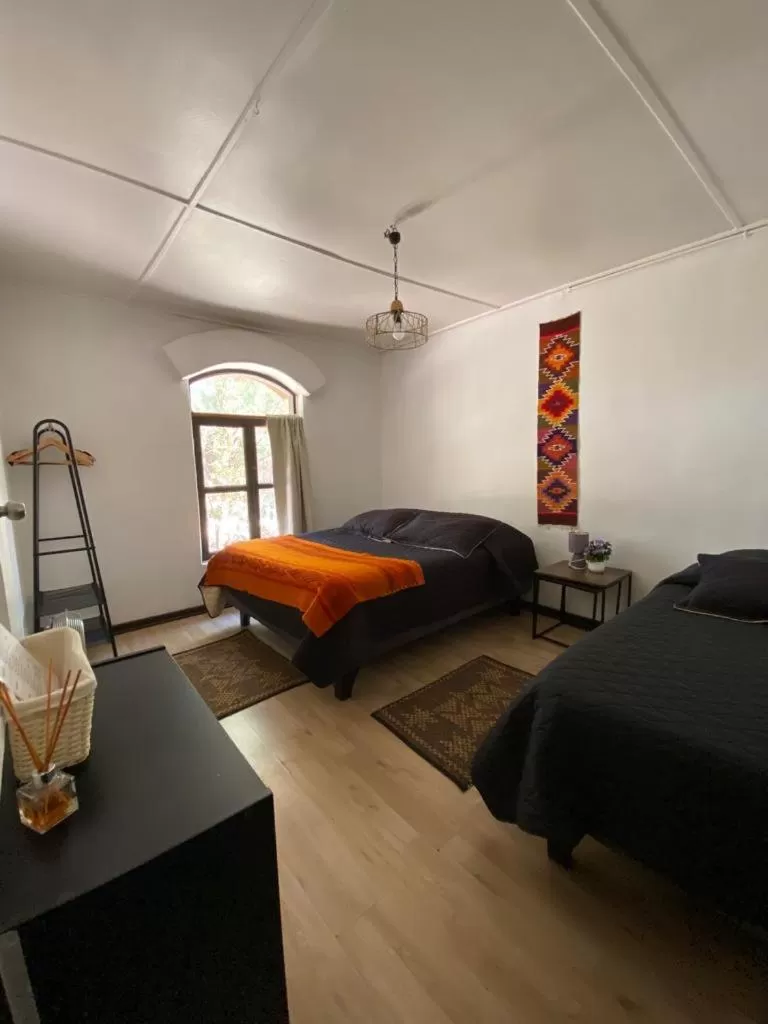 Photo of the whole room, Bed in CaminAndes Hostal