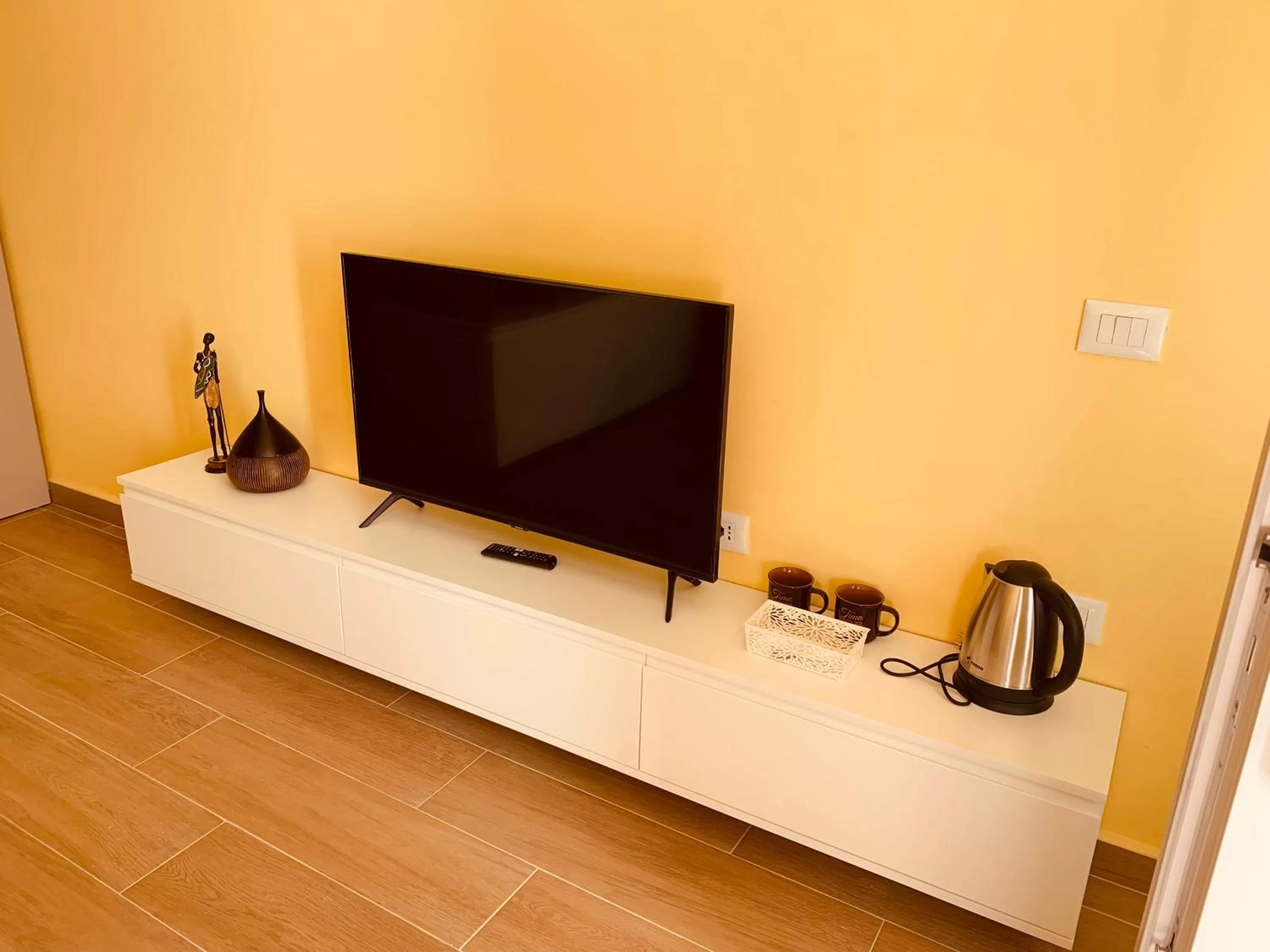 TV/Entertainment Center in Auto Tana Guest House