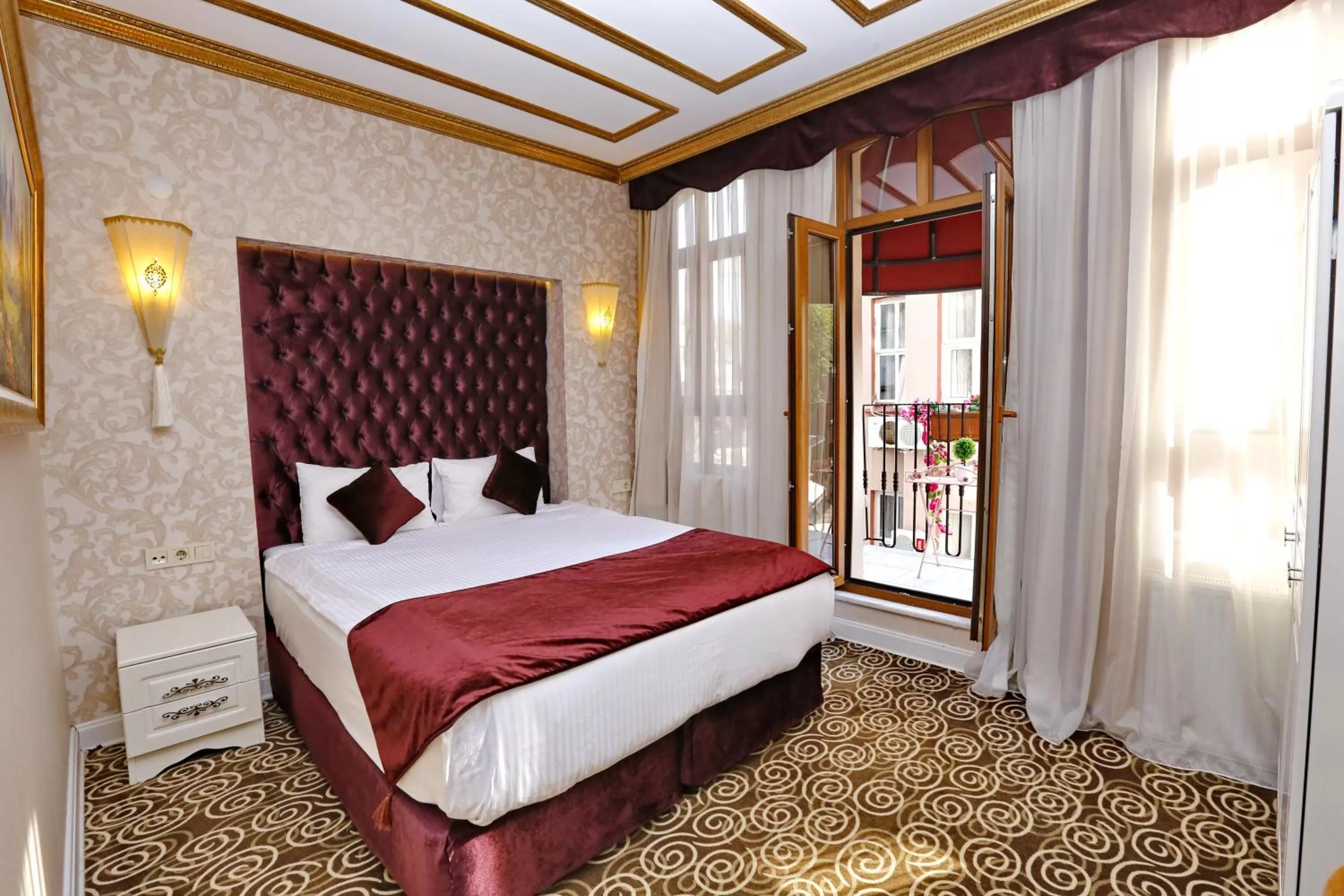 Bed in Diamond Royal Hotel