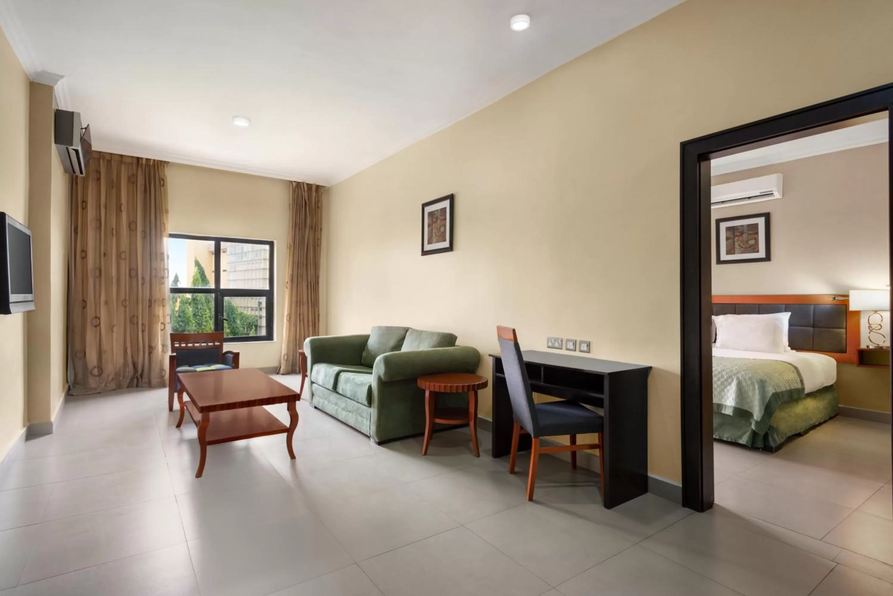 Living room, Bed in Hawthorn Suites by Wyndham Abuja