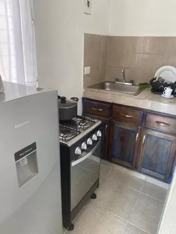 Kitchen/Kitchenette in Chao Mamá Hostal