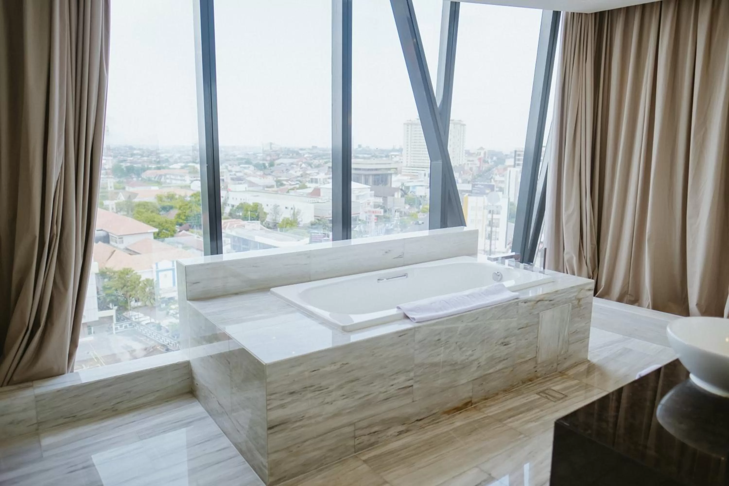Bathroom, Bed in PO Hotel Semarang
