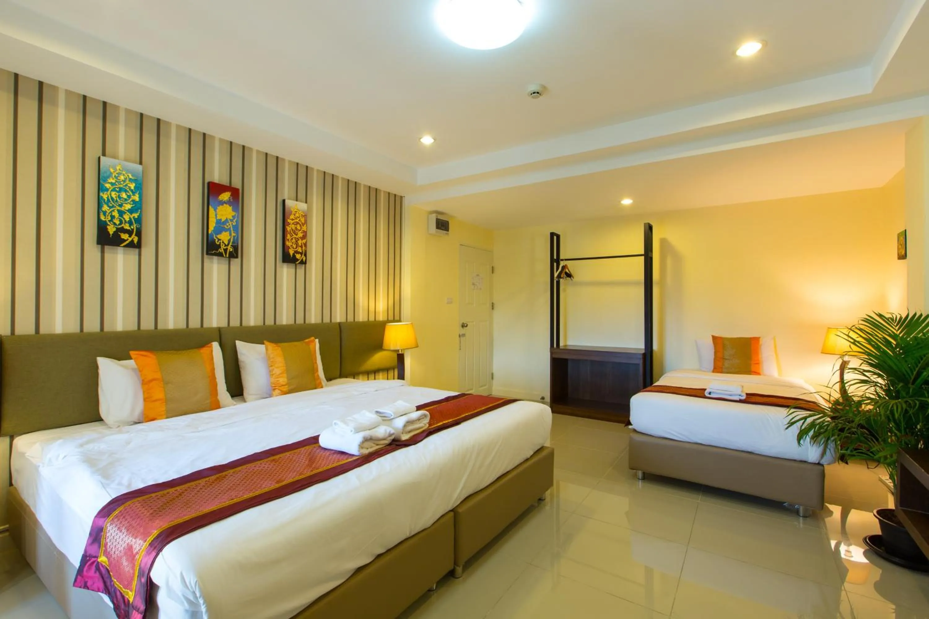Photo of the whole room, Bed in Chiang Mai Waroros Boutique Hotel