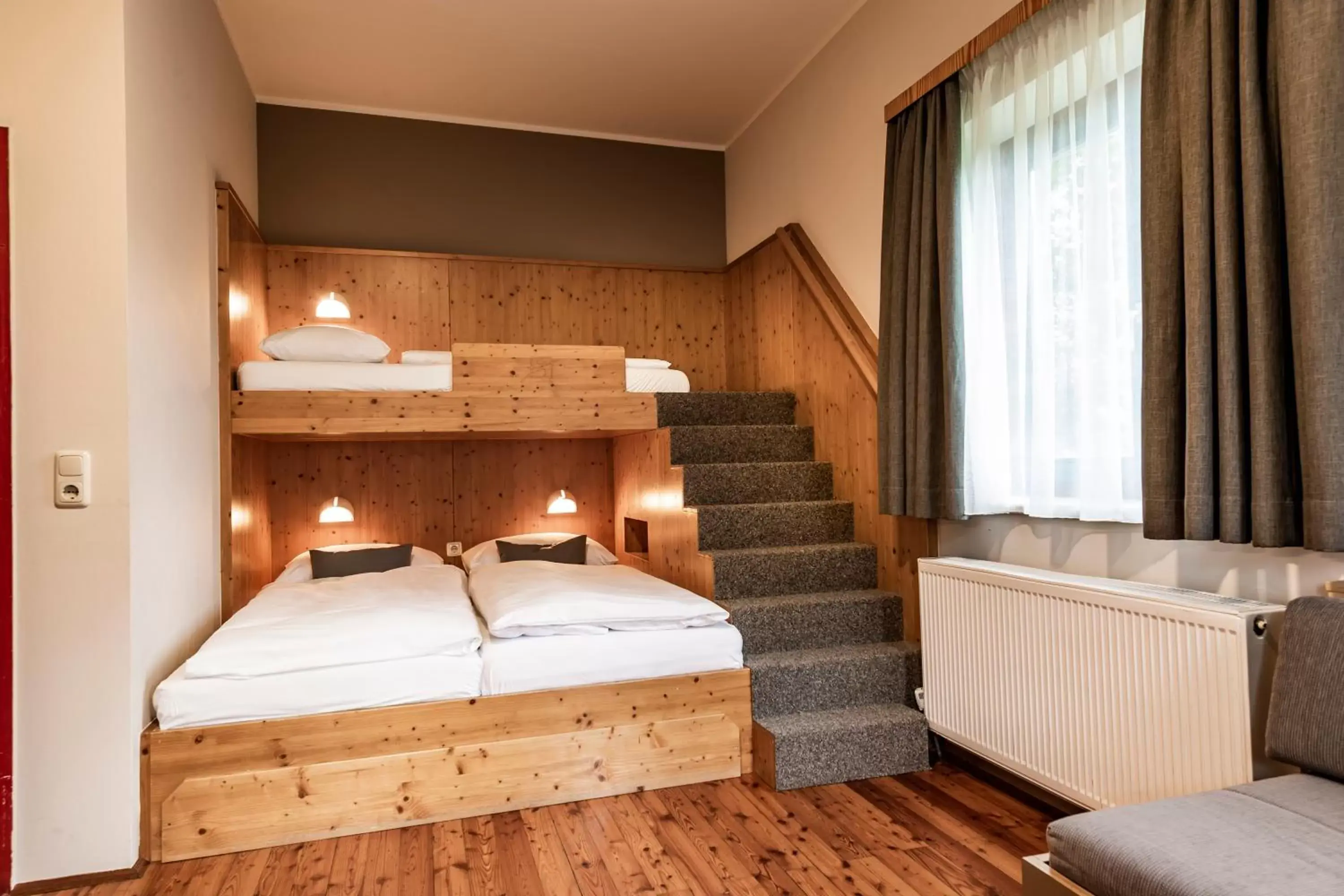 Quadruple Room in JUFA Hotel Lipizzanerheimat Quadruple Room in JUFA Hotel Lipizzanerheimat