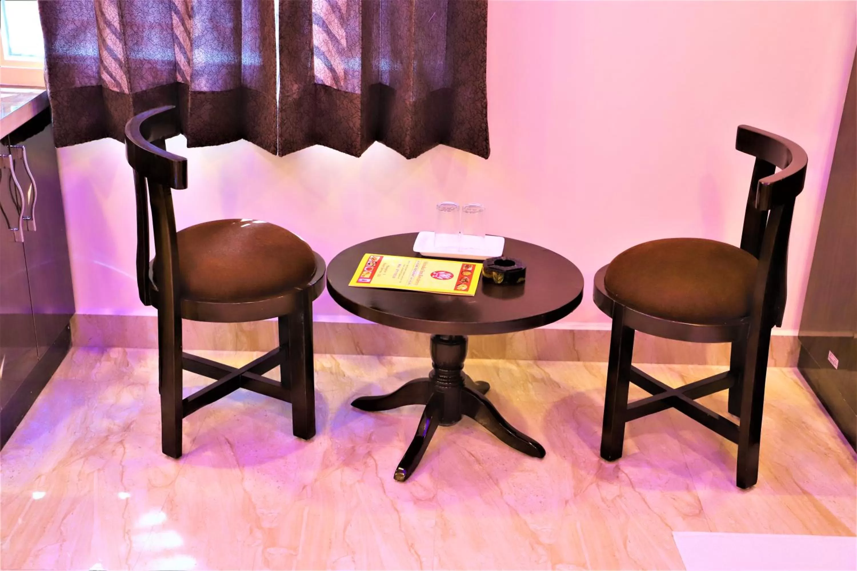 Seating area in Airport Hotel Shivaka Inn