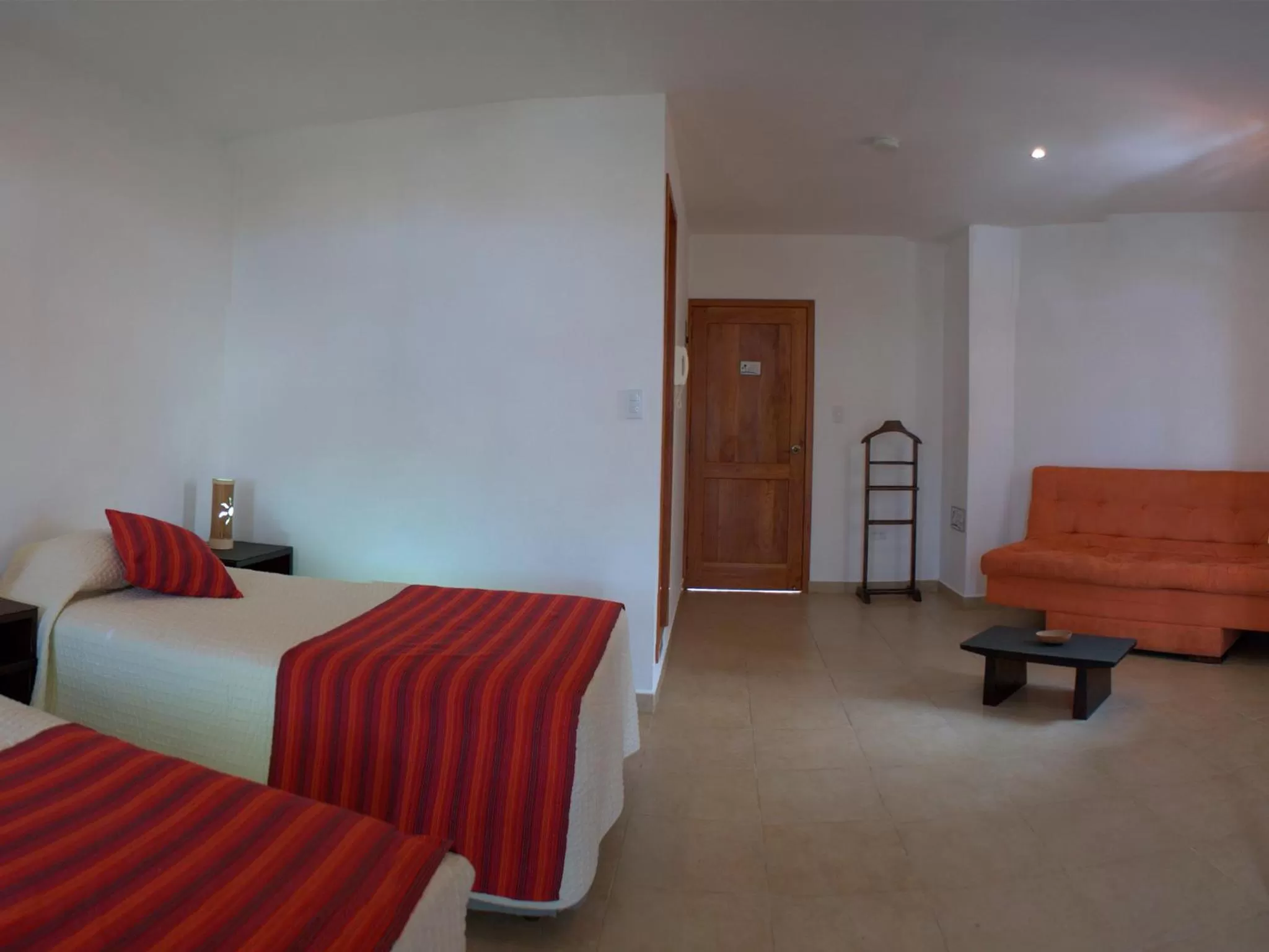 Bed in Hotel Galapagos Suites B&B