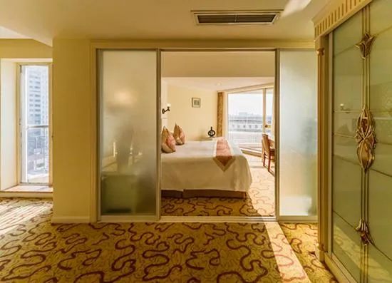 Bed in Huiquan Dynasty Hotel Qingdao