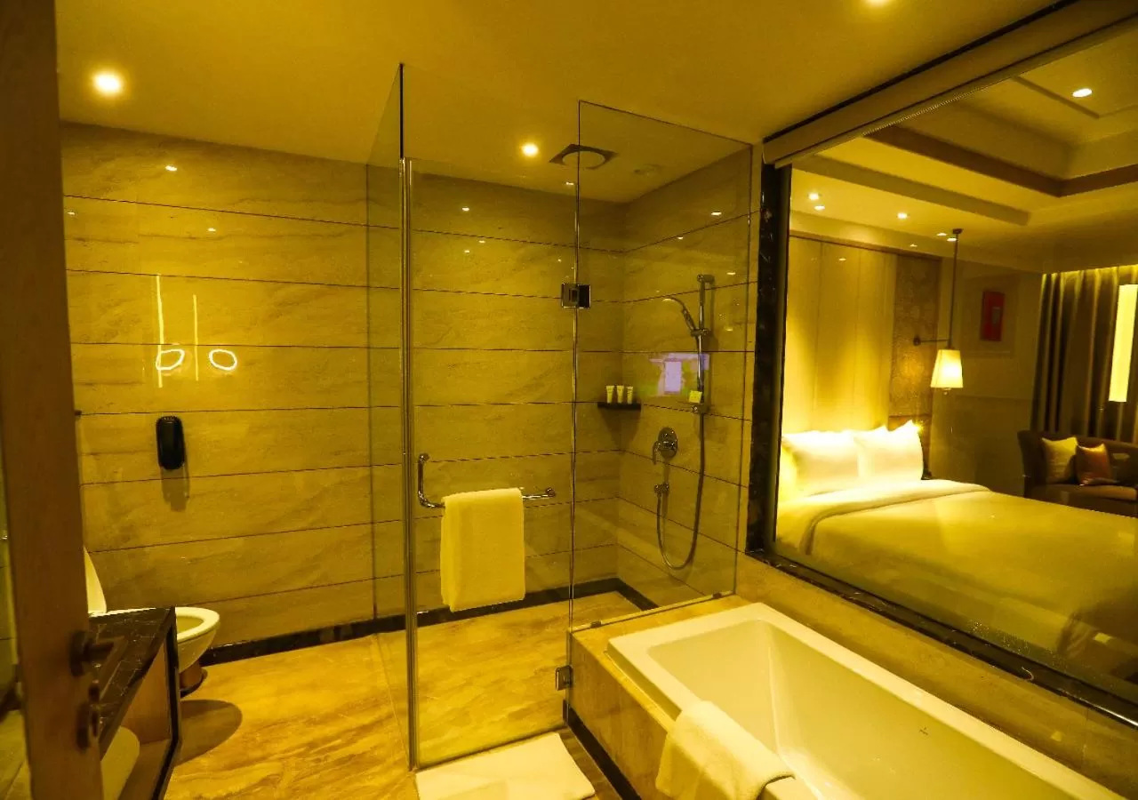 Bathroom, Bed in Radisson Bhopal