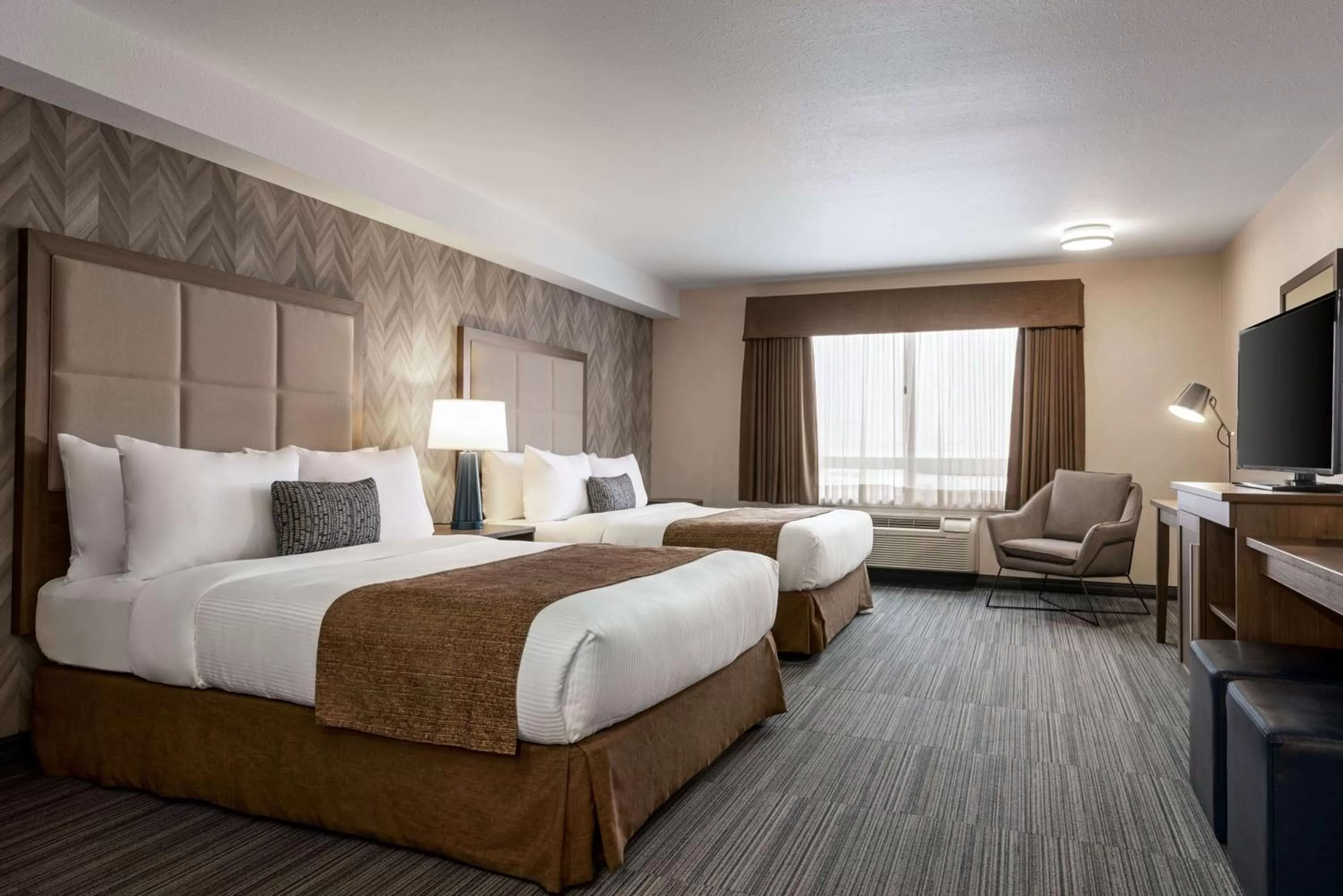 Photo of the whole room, Bed in Ramada by Wyndham Airdrie Hotel & Suites