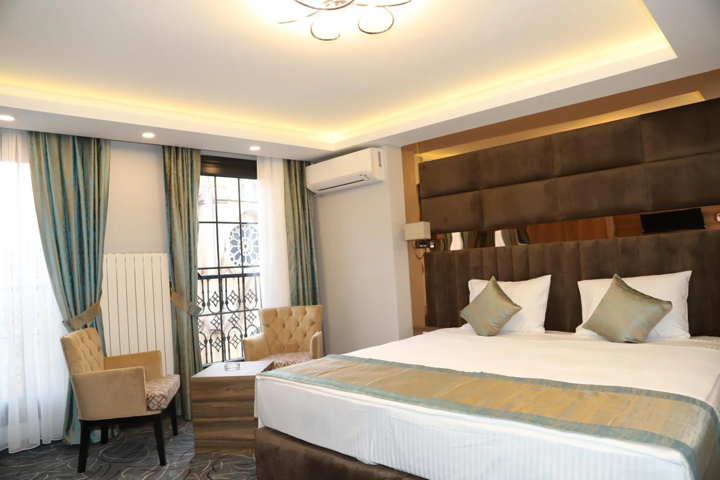 Bed in Grand Kavi Hotel