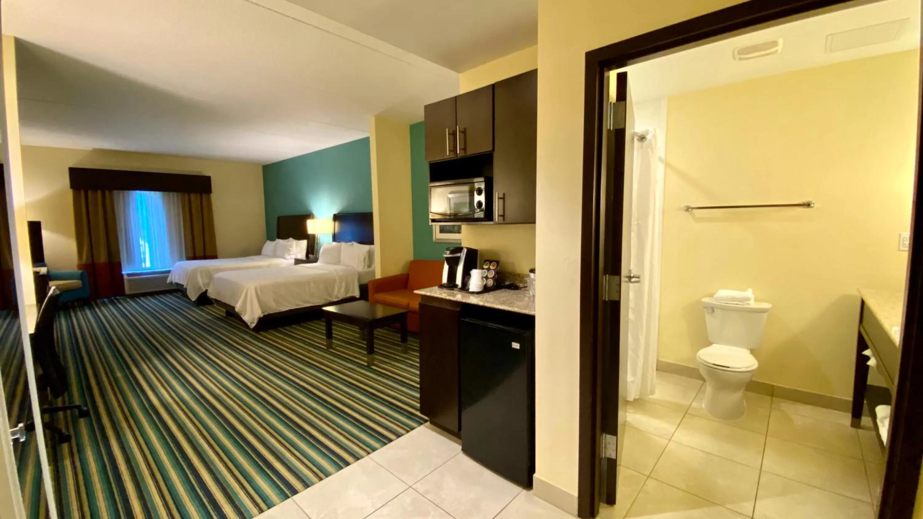 Bedroom, Bed in Holiday Inn Express Hotel & Suites Orlando East-UCF Area by IHG
