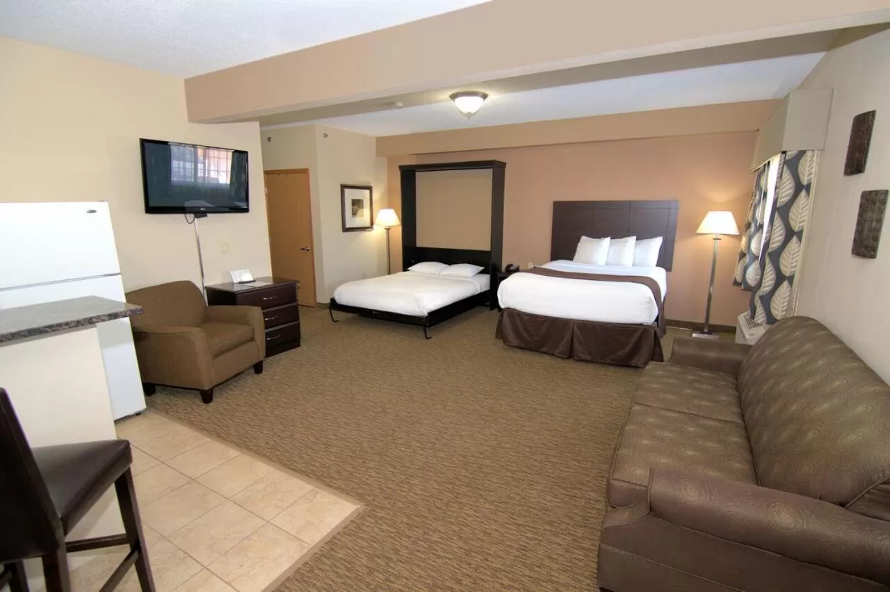 Bed in Rock Island Inn & Suites