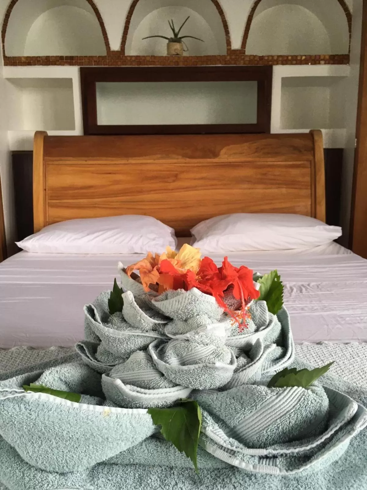 Bed in Bird Island Bungalows