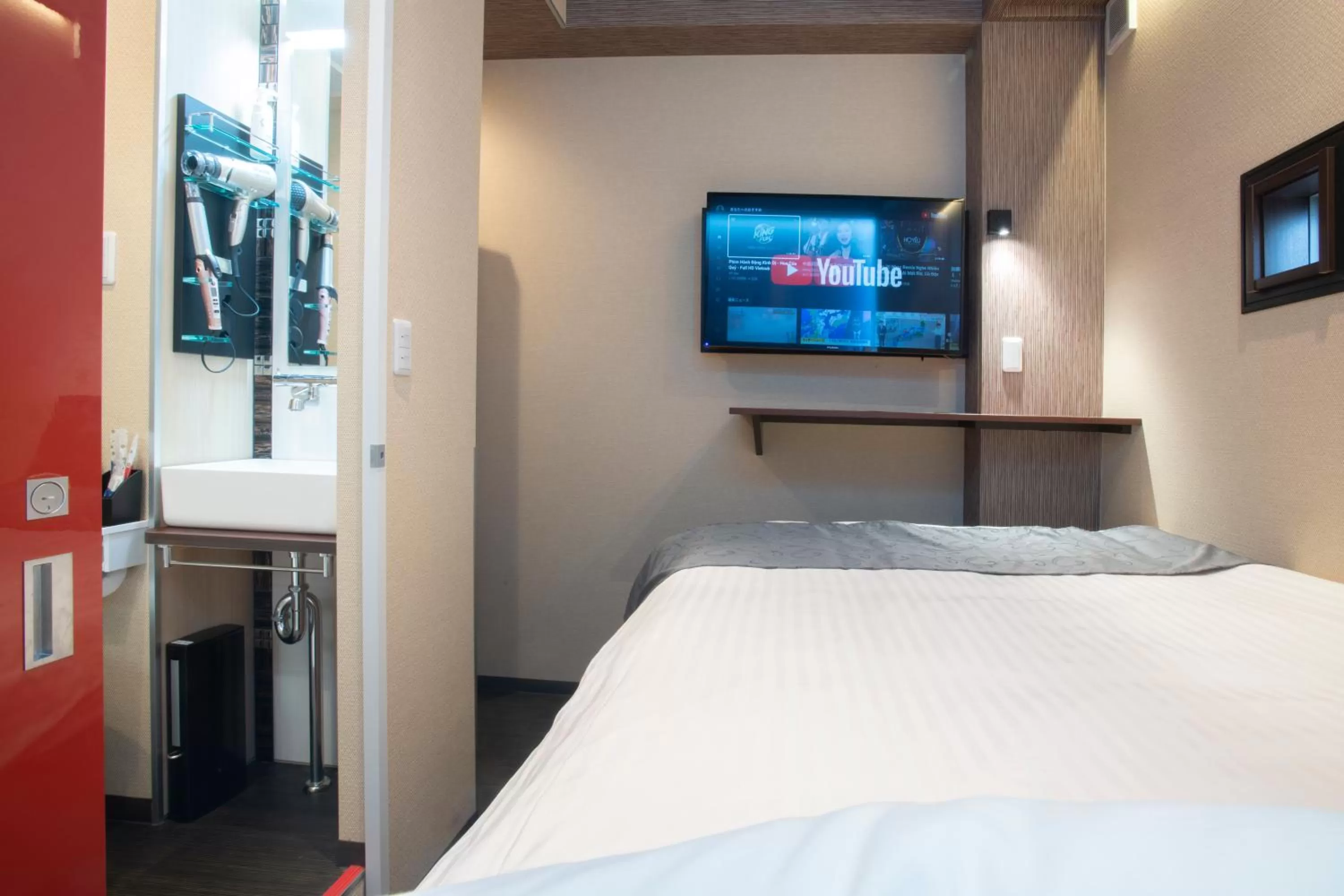 Photo of the whole room, Bed in Pinpon Hotel Hiroshima