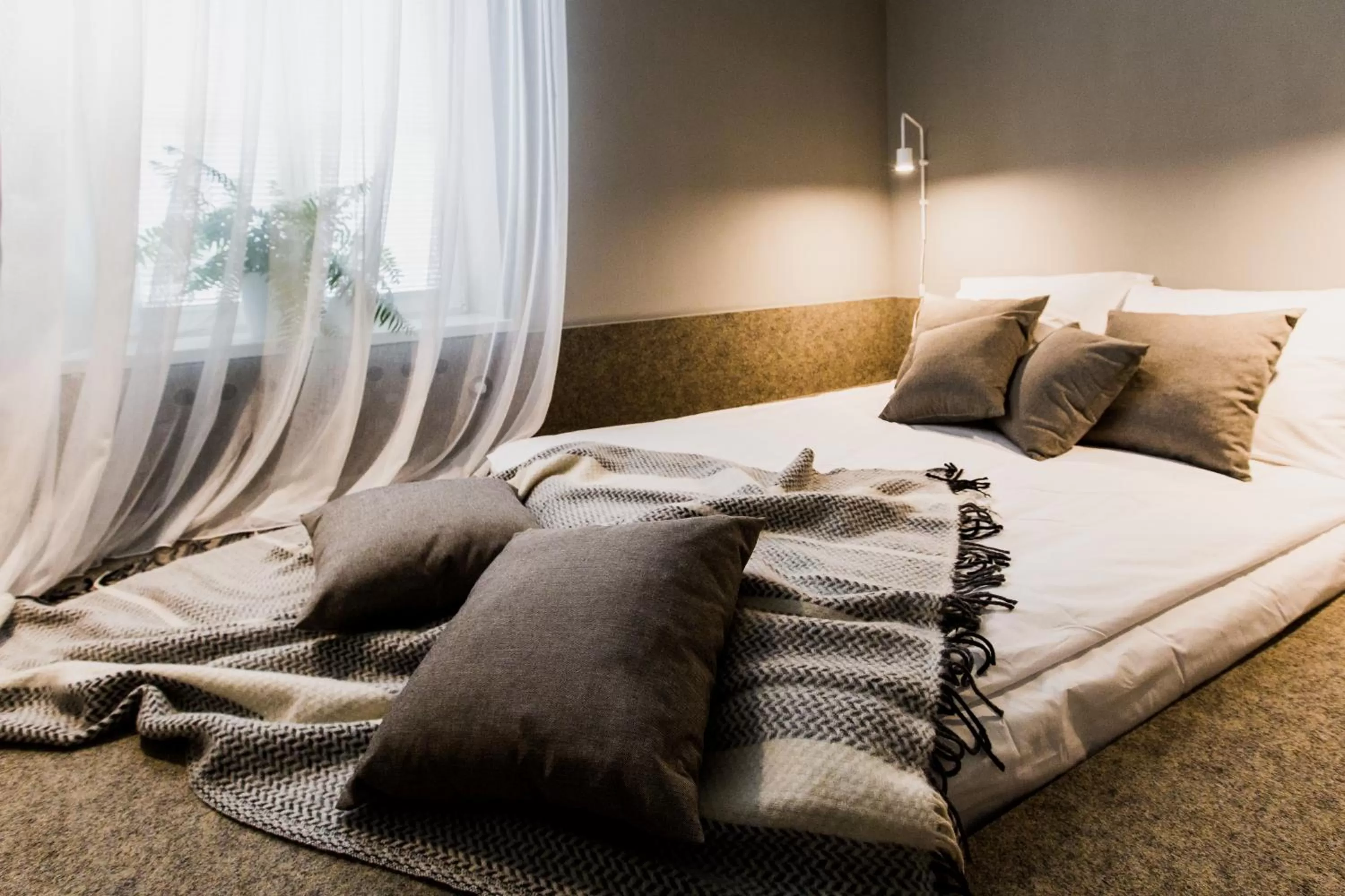 Seating area, Bed in Apartamenty Browar Perła - Perła Brewery Apartments