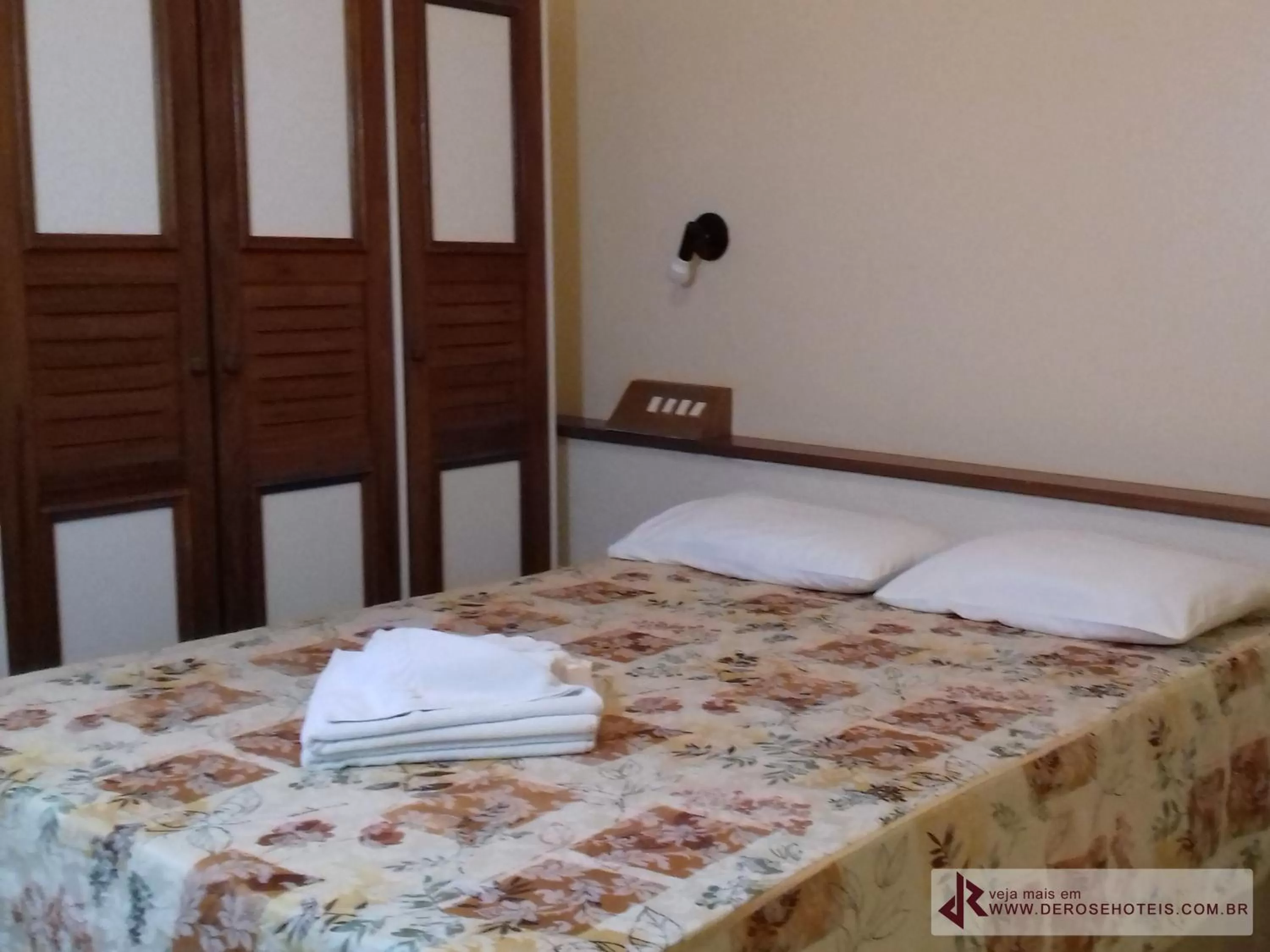 Bed in De Rose Palace Hotel