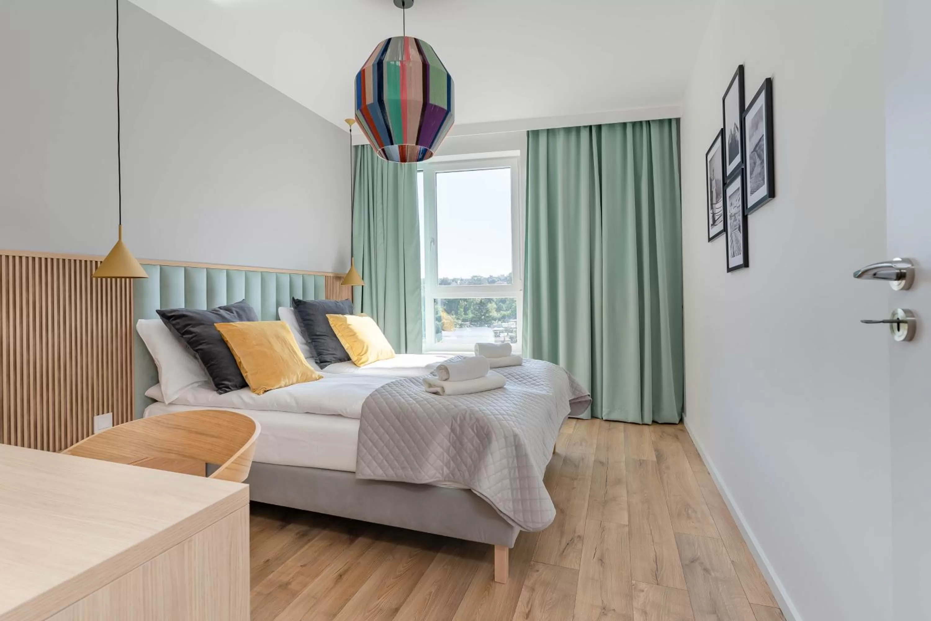 Bed in Symphony Modern Tower Apartamenty