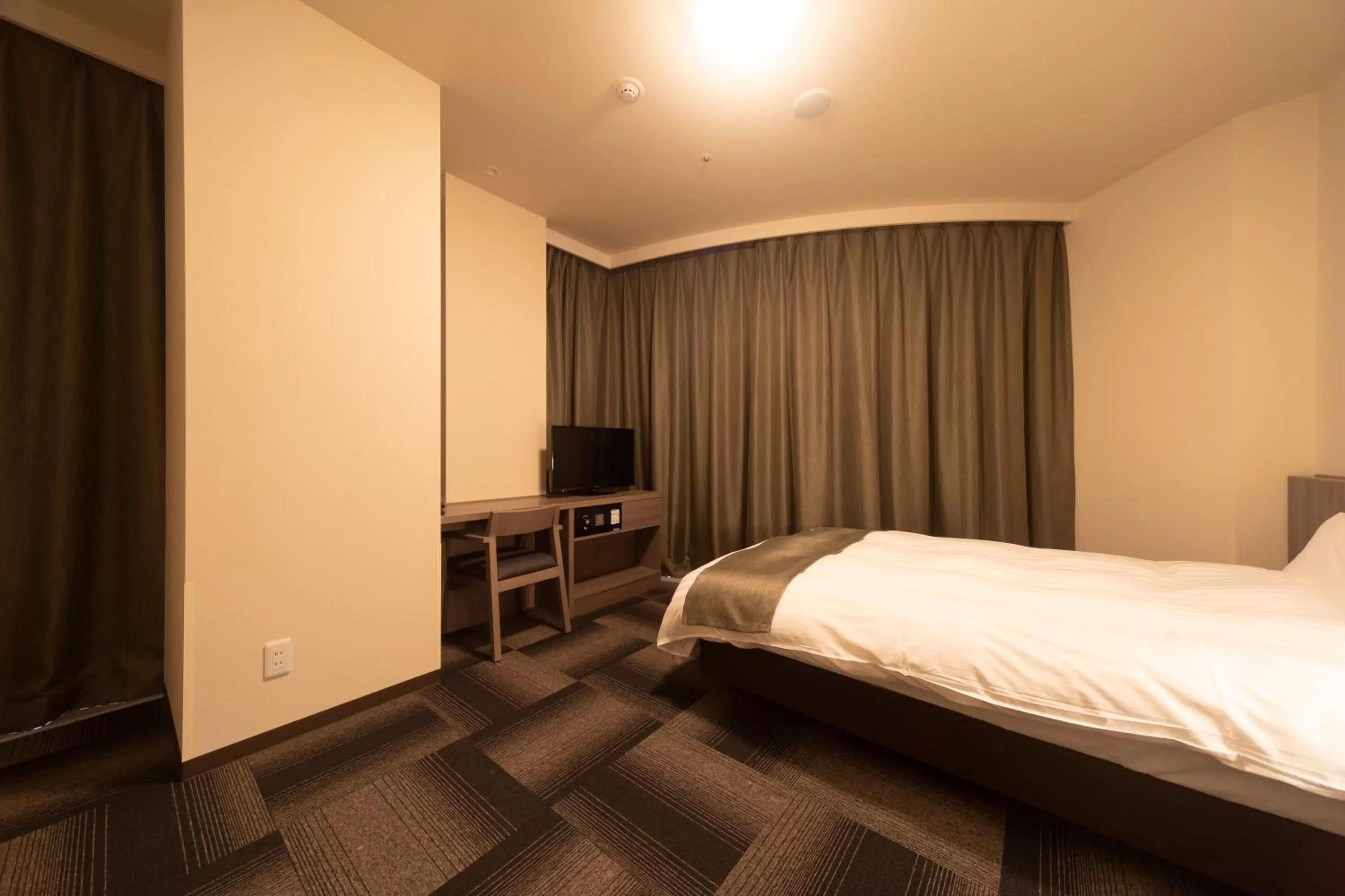 Bed in Dormy Inn Korakuen