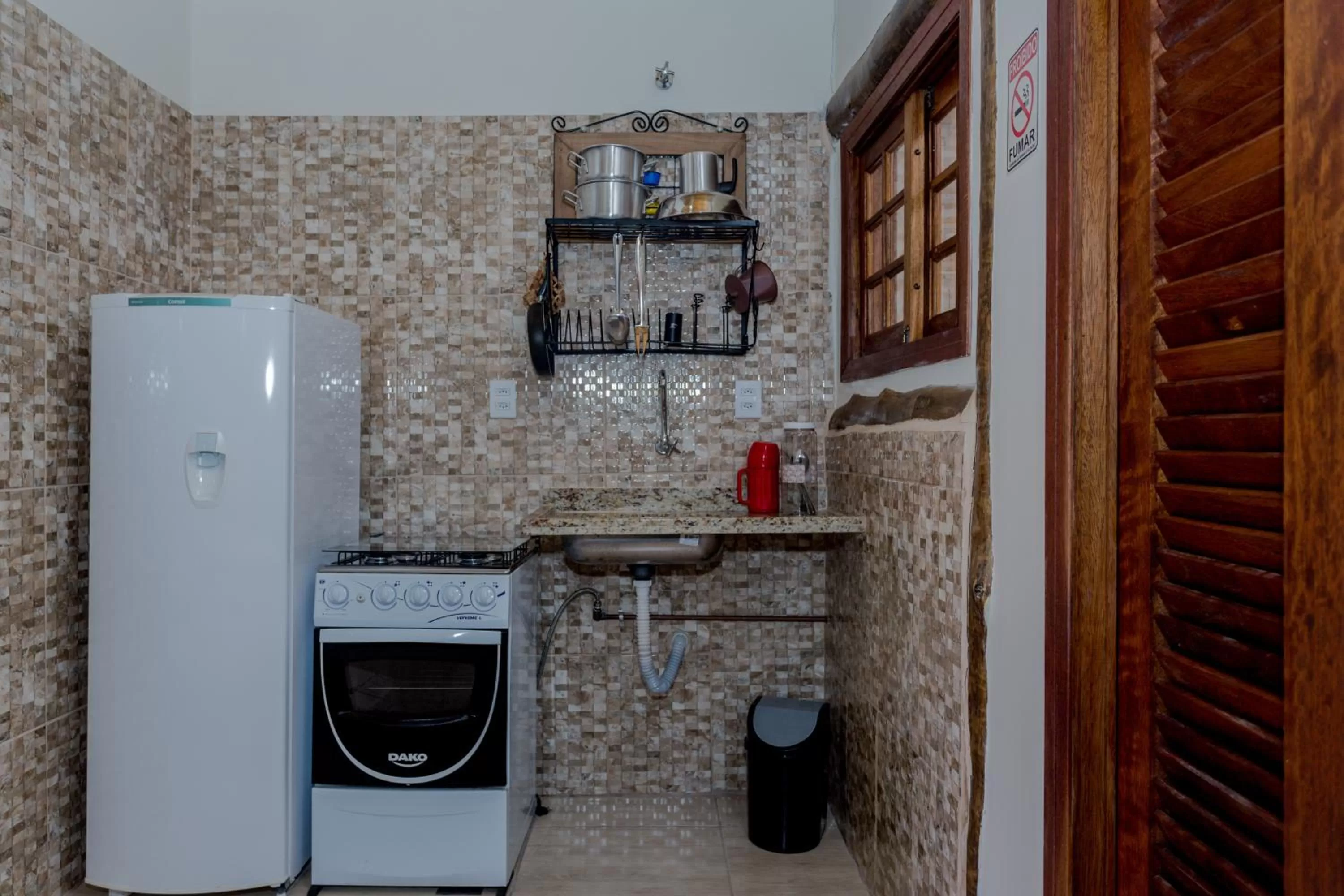 Kitchen or kitchenette in Pousada Chalés do Julião