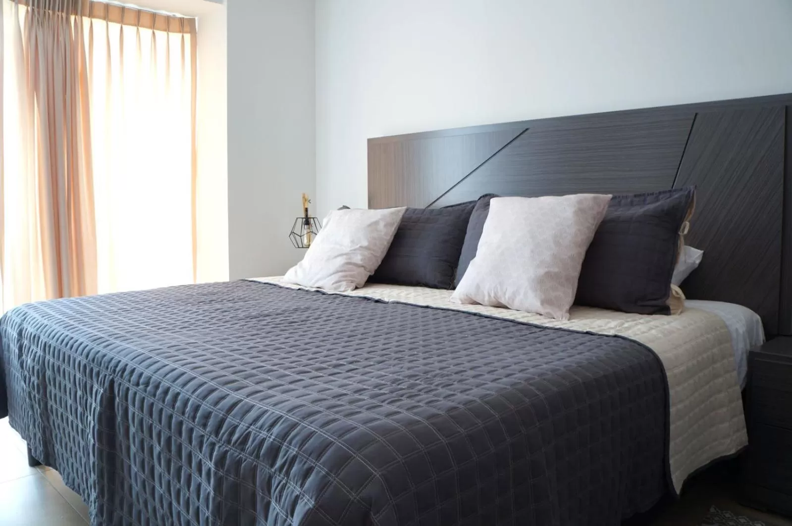 Bed in Metropolitan Suites