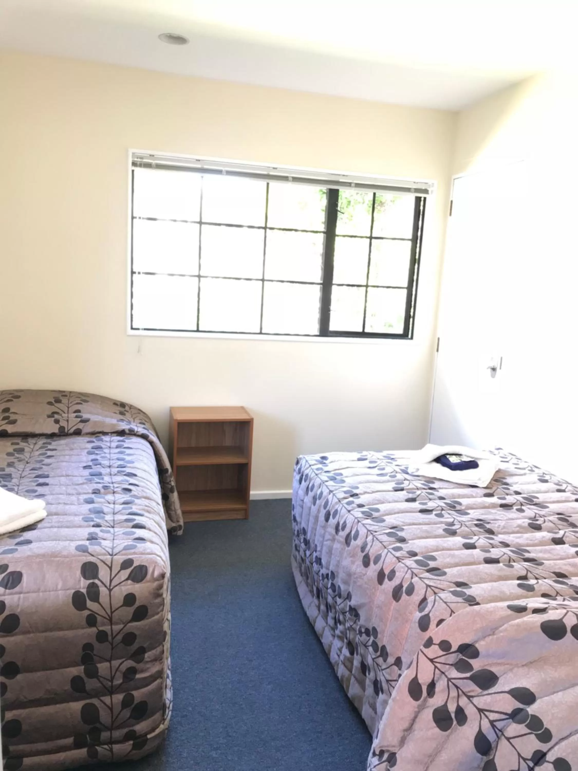 Bed in Tudor Lodge Motel