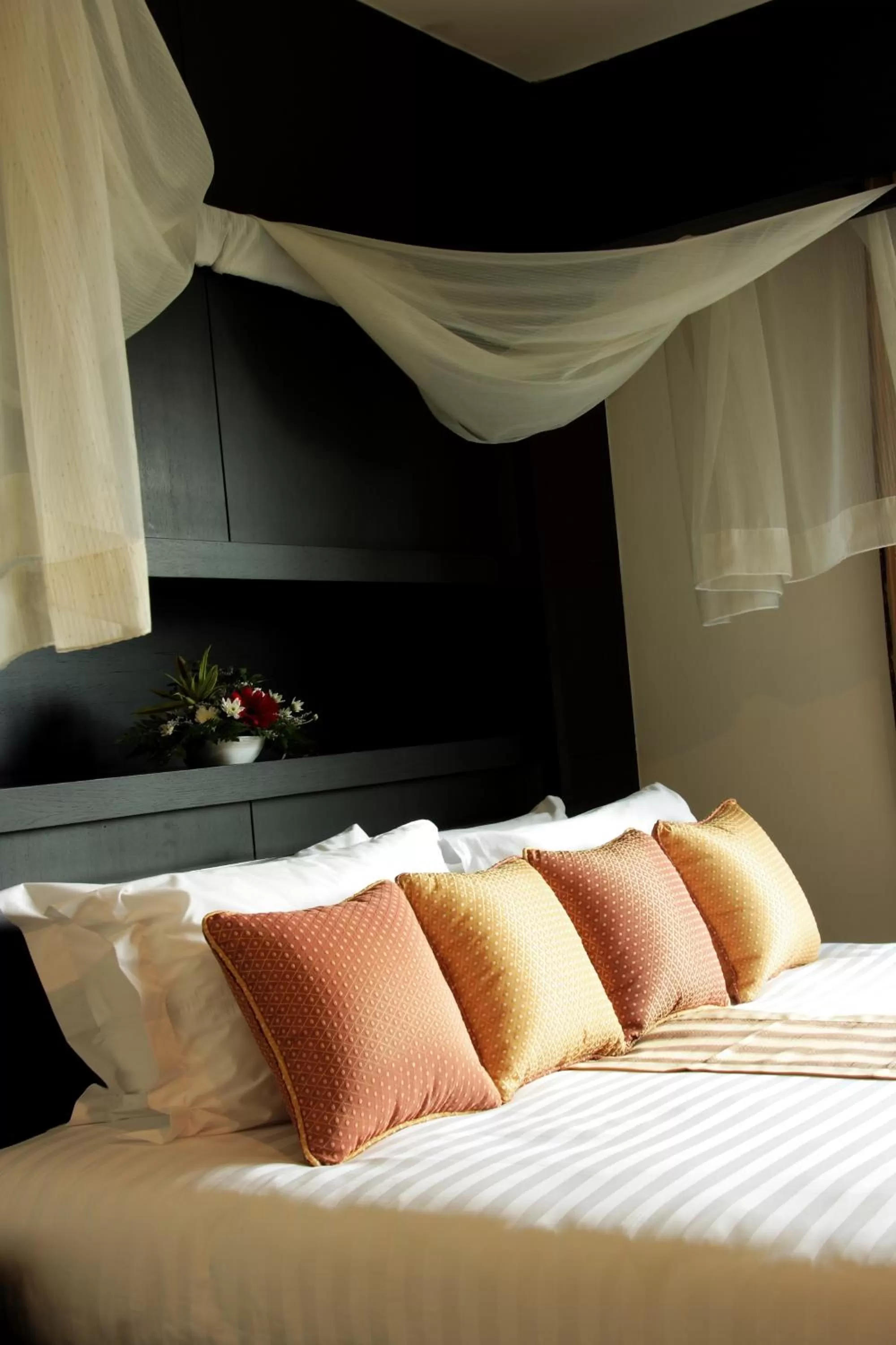 Bed in The Nouveau Chumphon Beach Resort And Golf