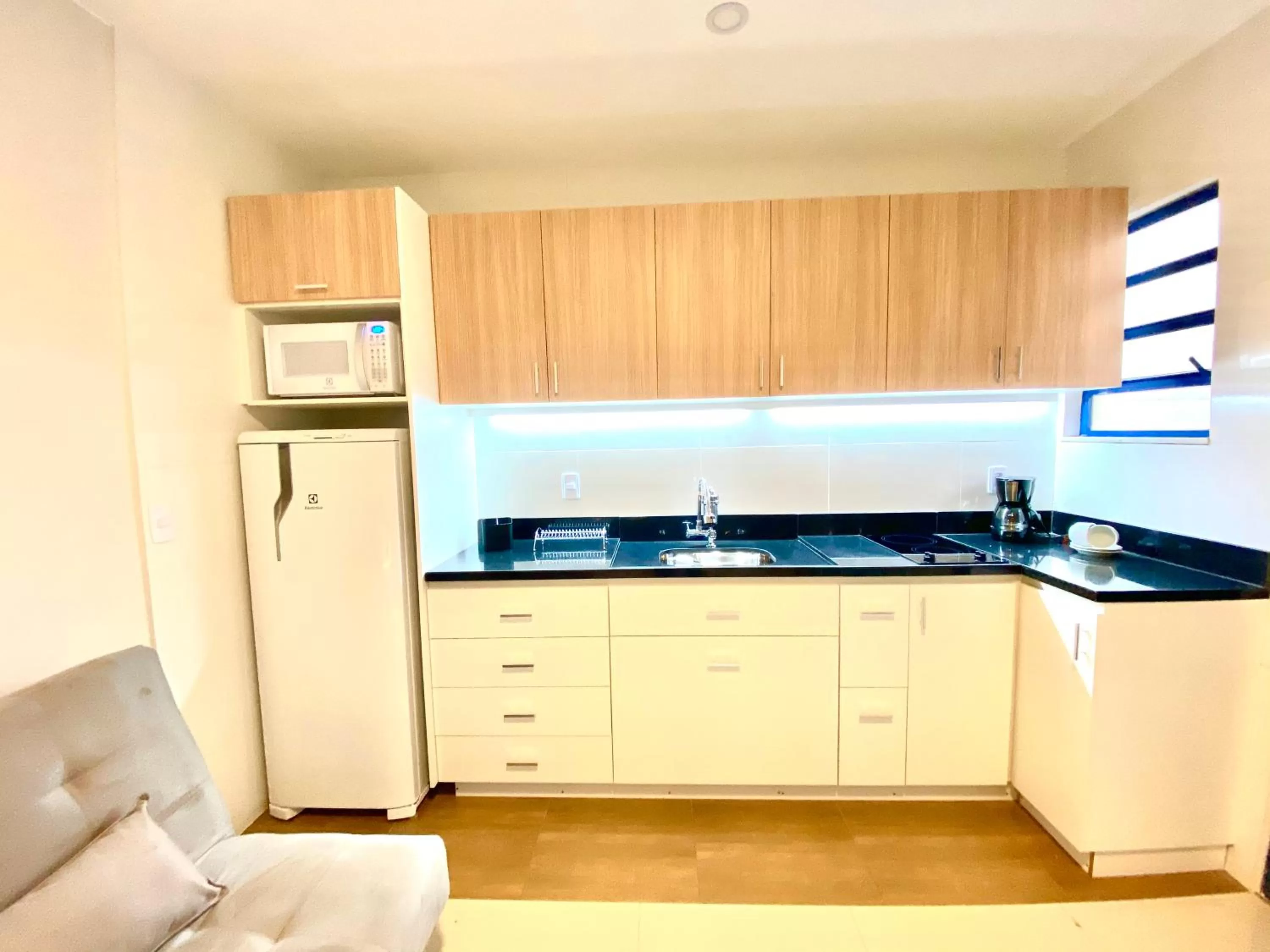 Kitchen or kitchenette in Injoy Suítes & Aparts