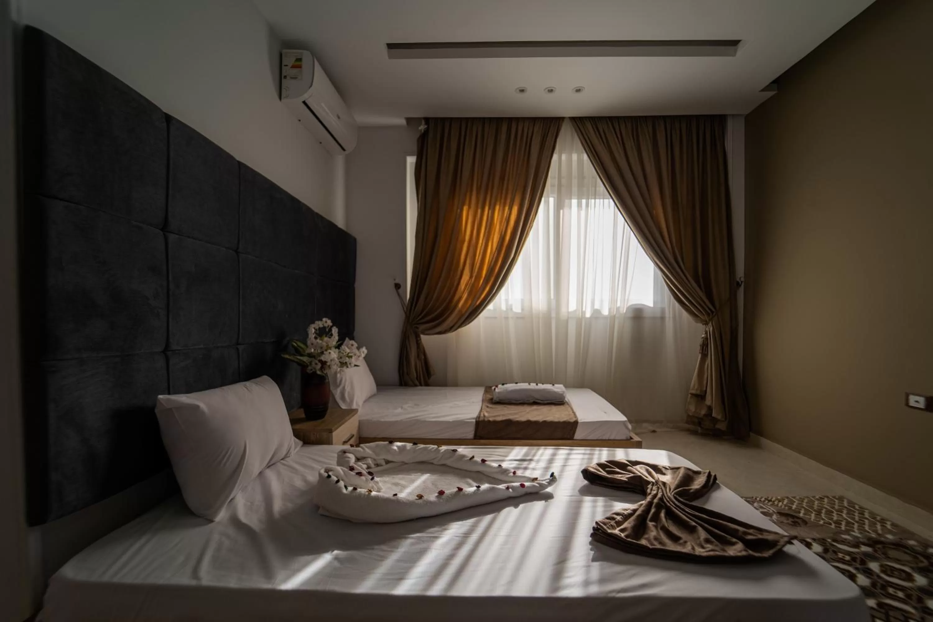 towels, Bed in Gardenia Inn Hotel
