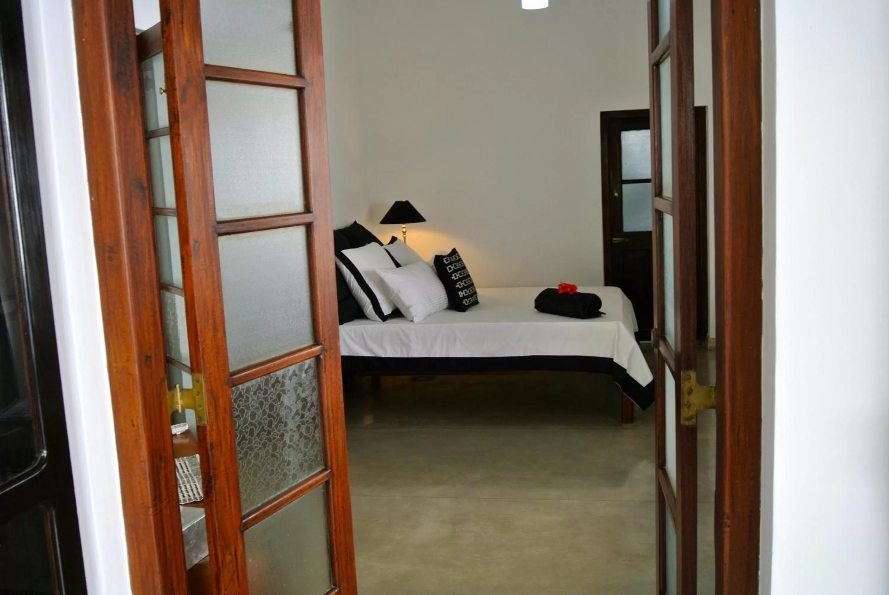 Photo of the whole room, Bed in "27" Spathodea- Oasis in the City