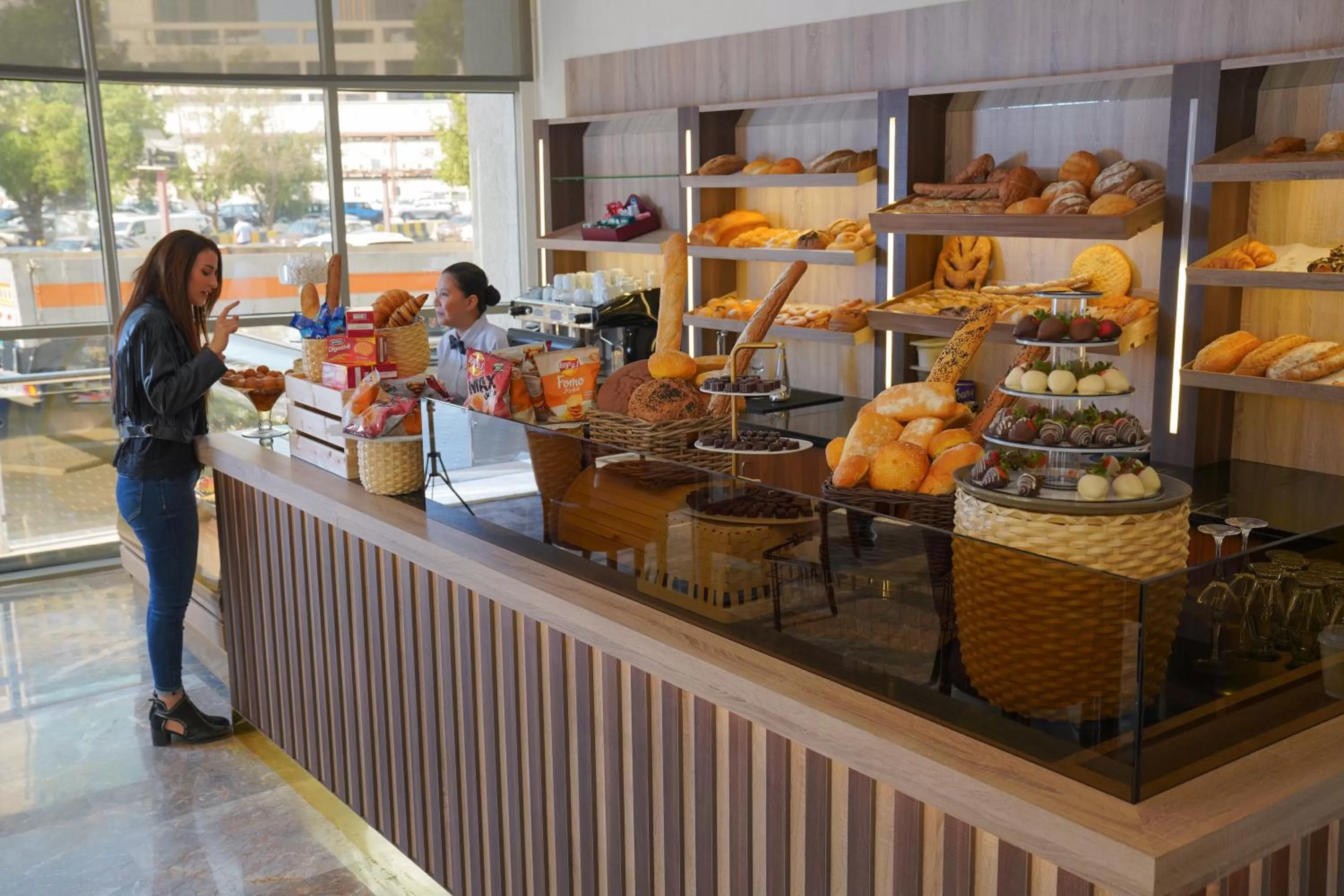 People in Ramada Encore by Wyndham Kuwait Downtown