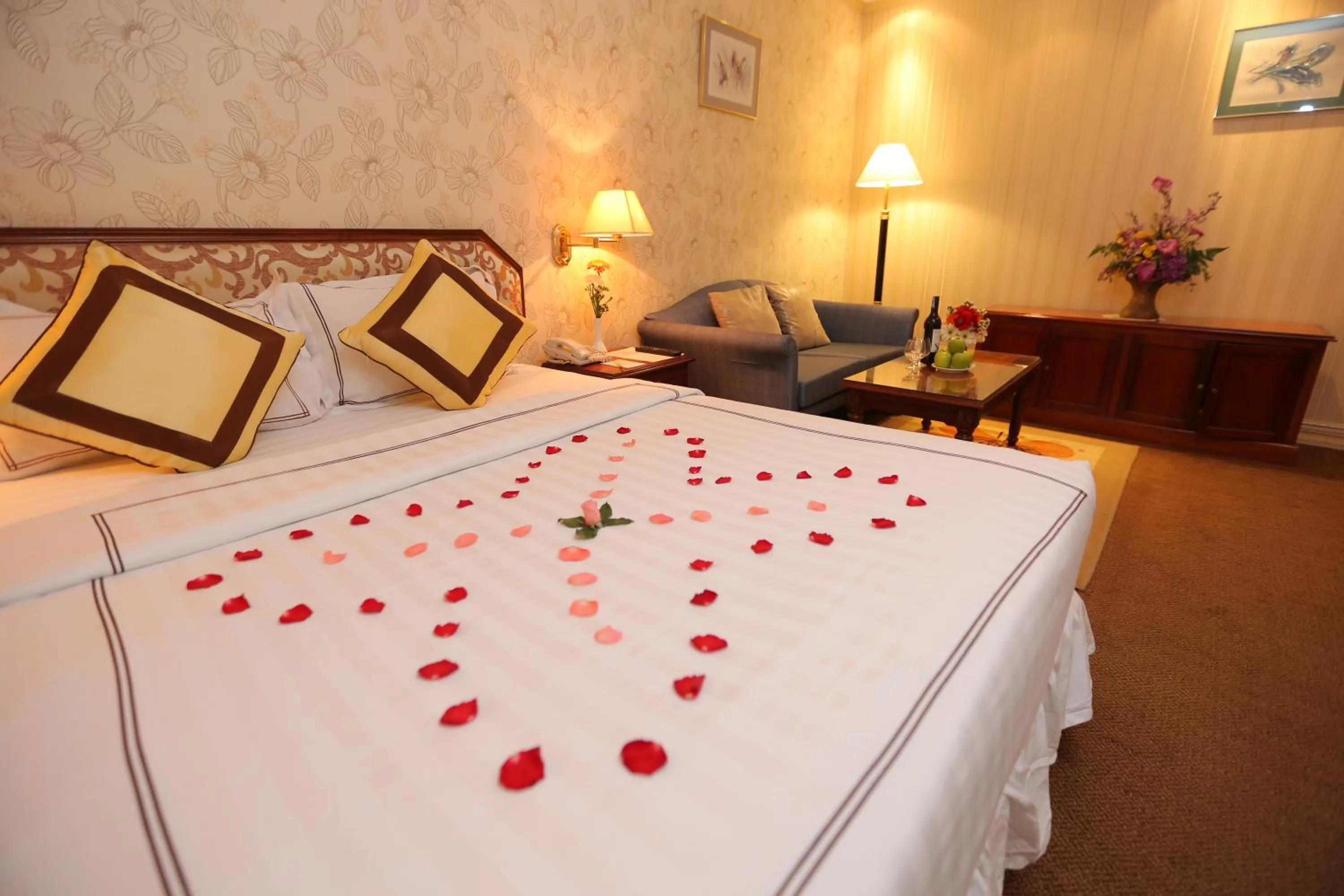 Living room, Bed in Lotus Saigon Hotel