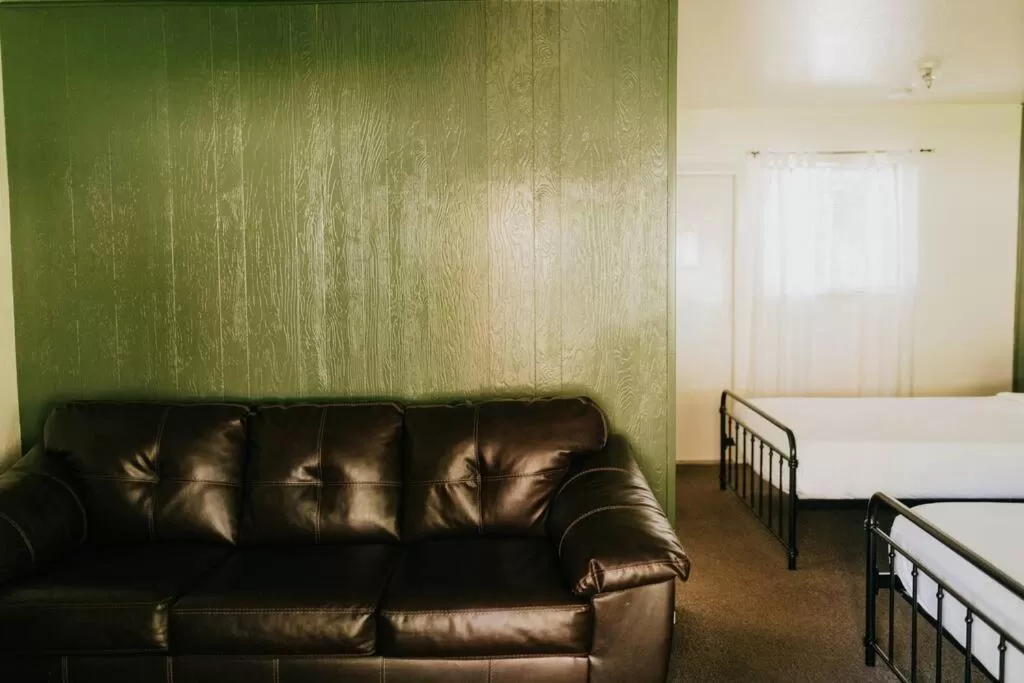 Seating area, Bed in The Long Barn Lodge