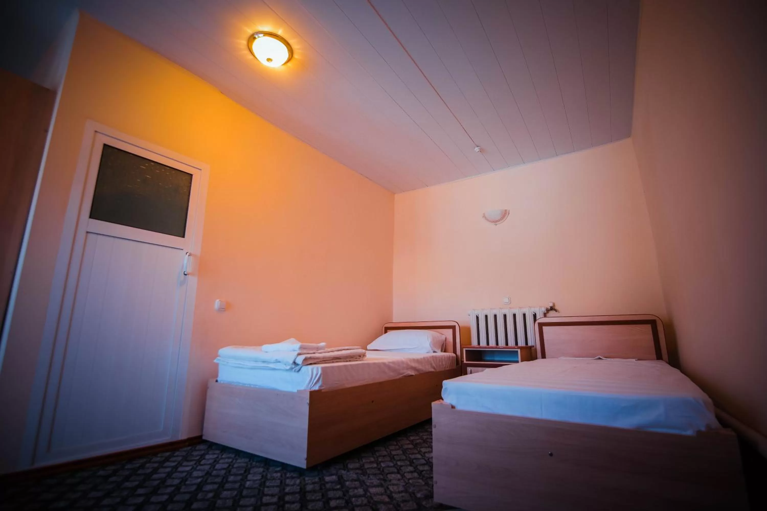 Bed in BUKHARA HOUSE hotel