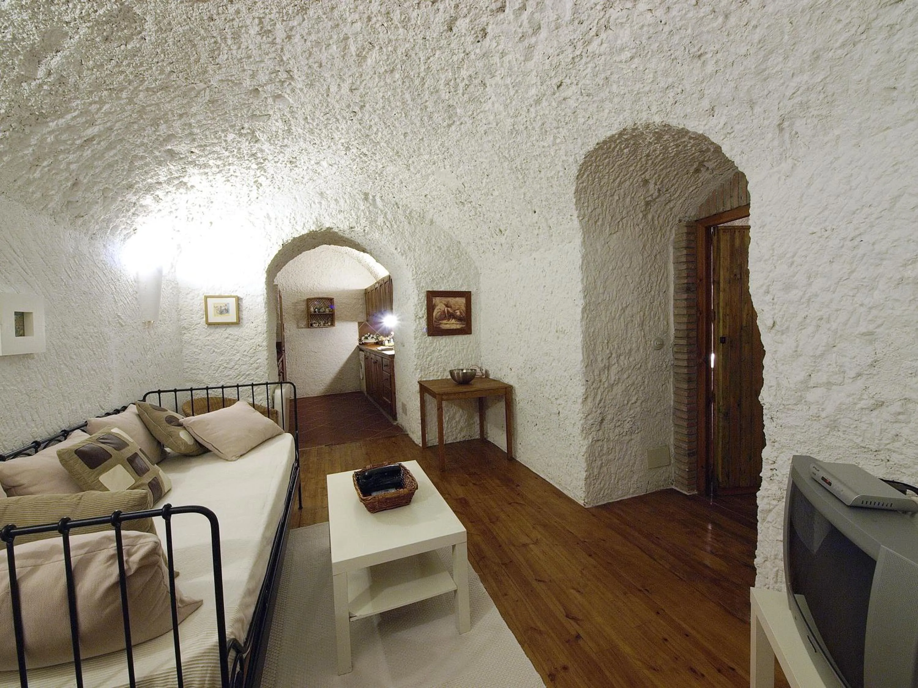 Living room, Bed in Casas Cueva y Cortijo La Tala en Guadix
