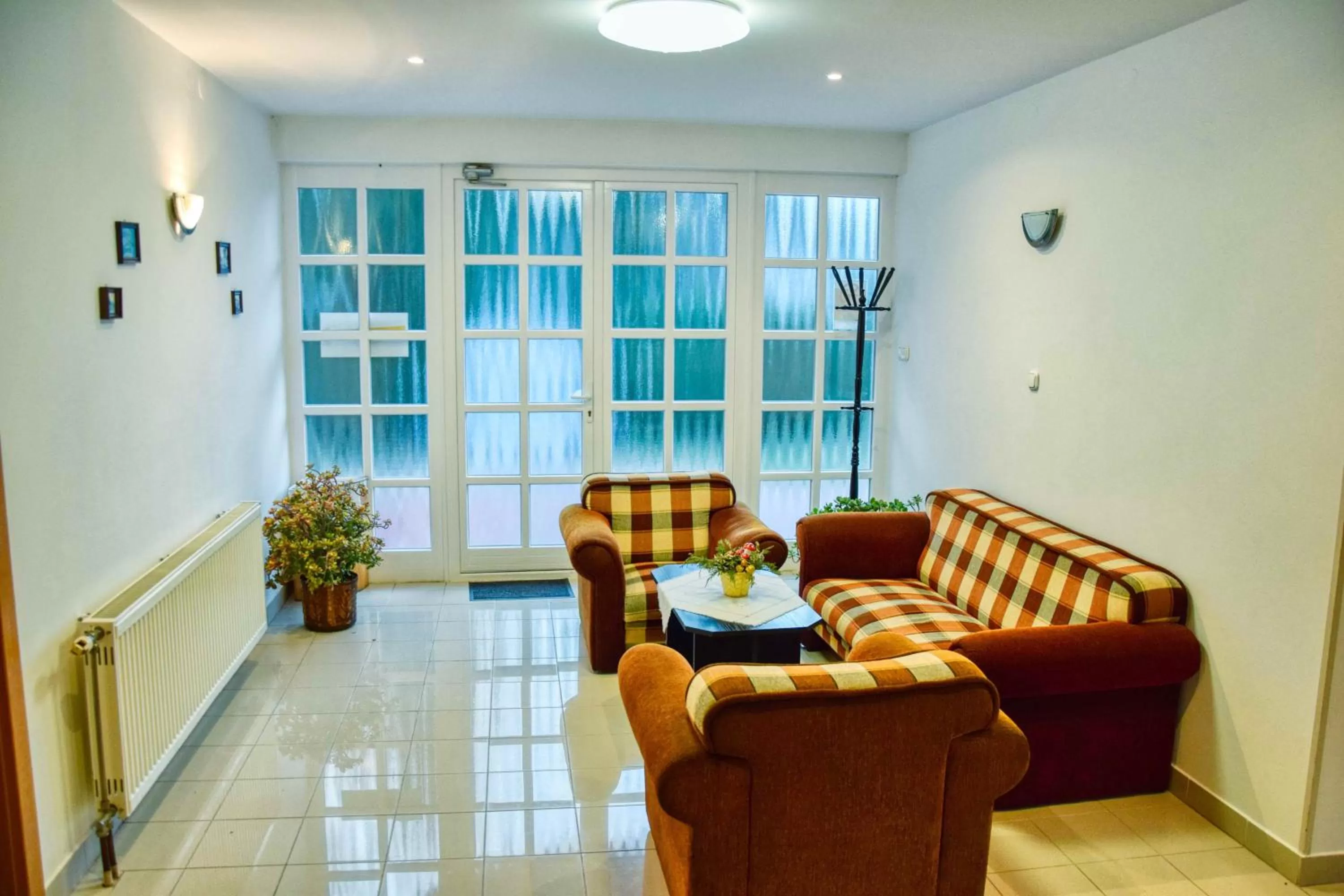 Communal lounge/ TV room, Seating Area in Hotel Penta Lux