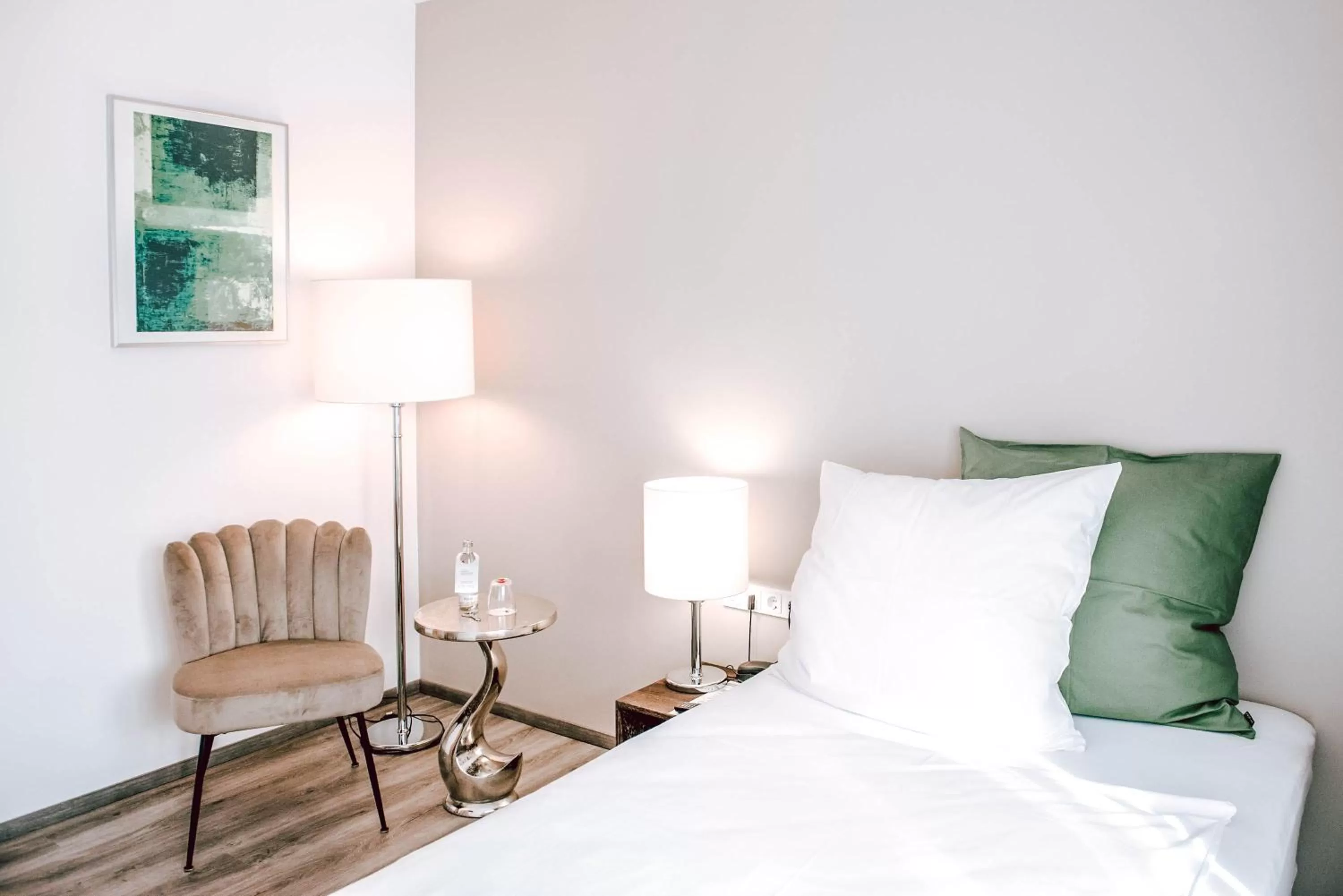 Bed in Concorde Business Boutique Hotel