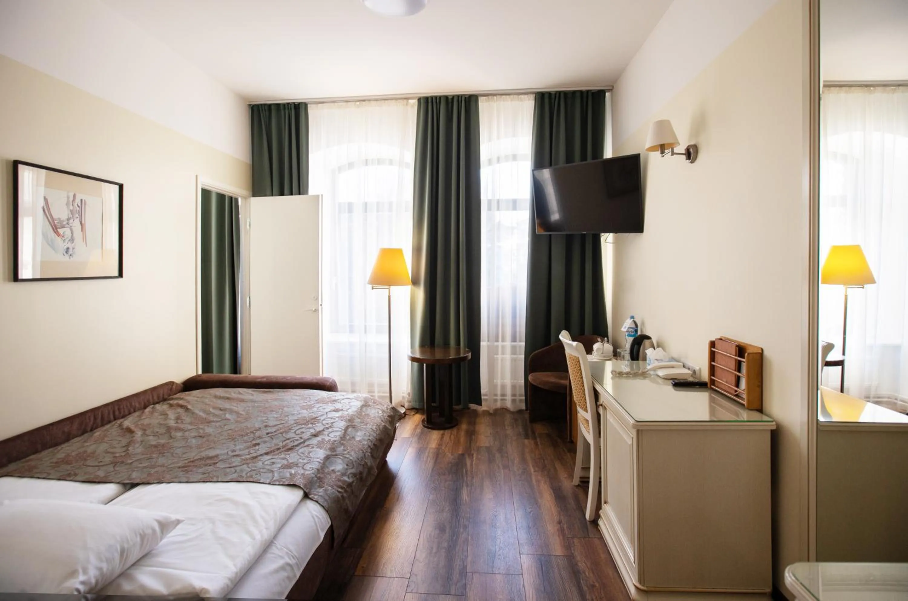 Seating area, Bed in Hotel St. Barbara