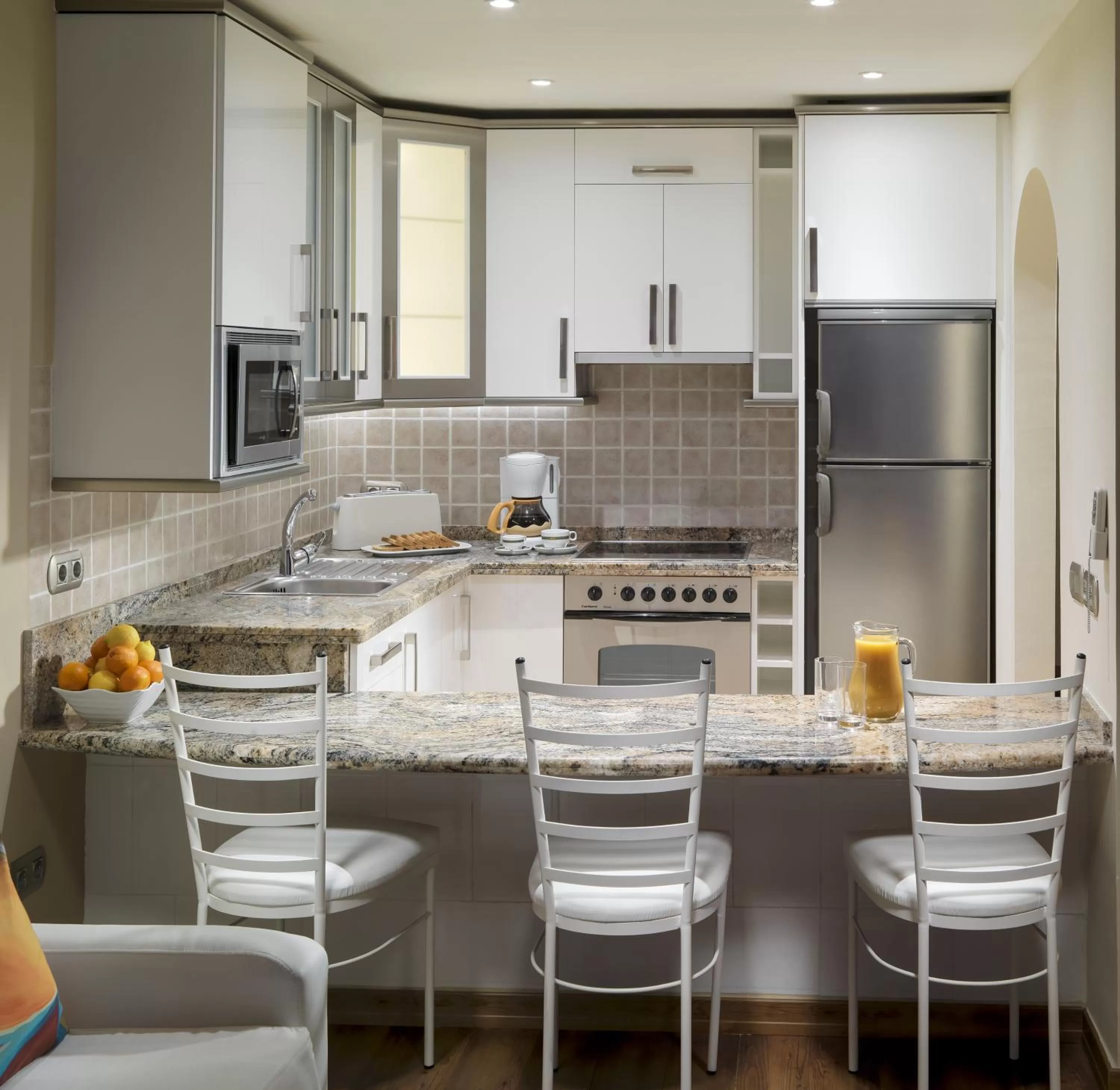 Kitchen or kitchenette in Regency Torviscas Apartments and Suites