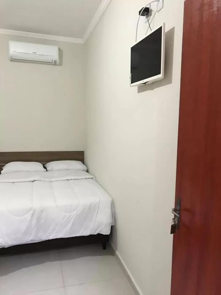 Bed in Leati's Hotel