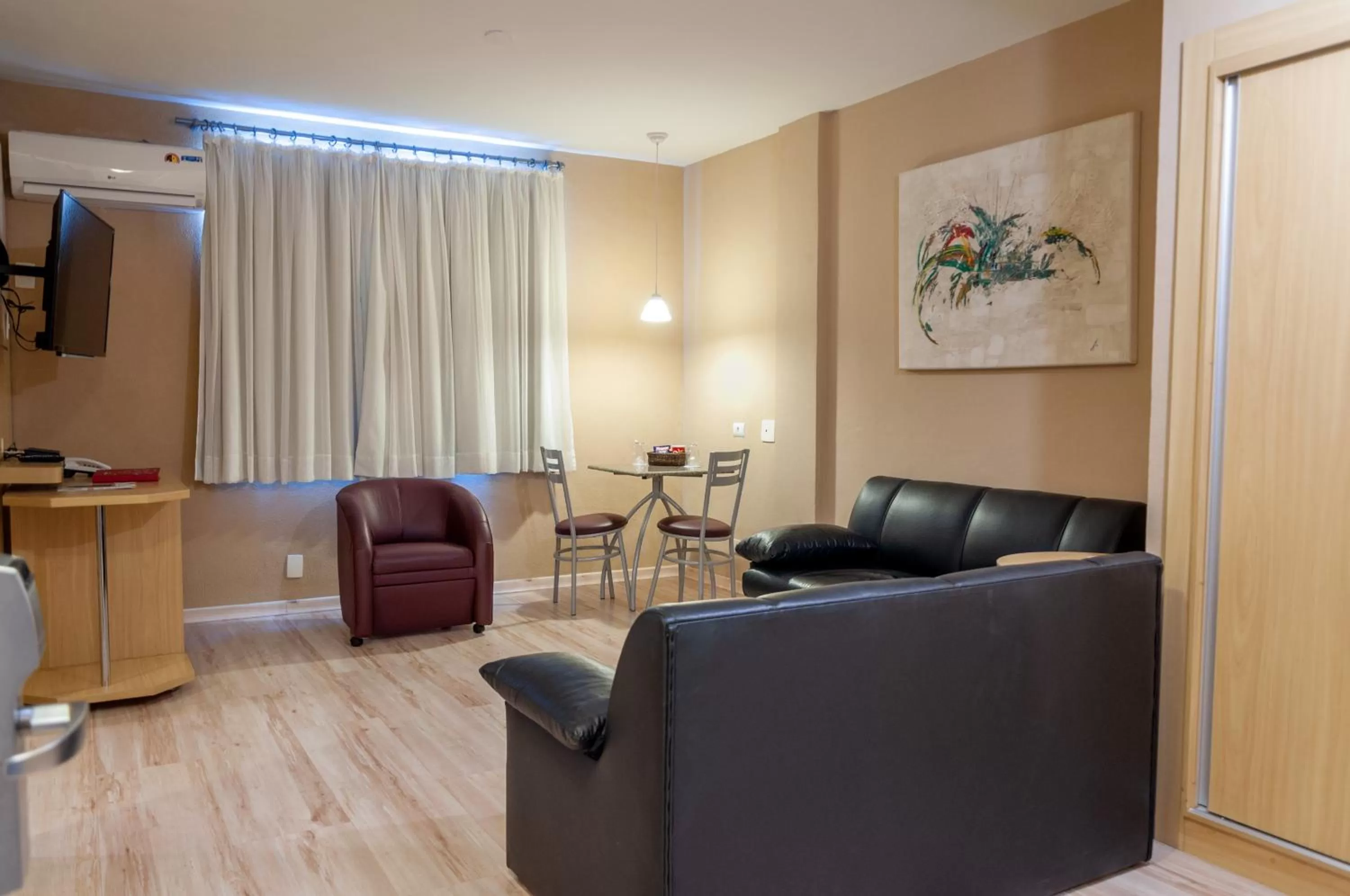 Living room in SJ Executive - San Juan Curitiba