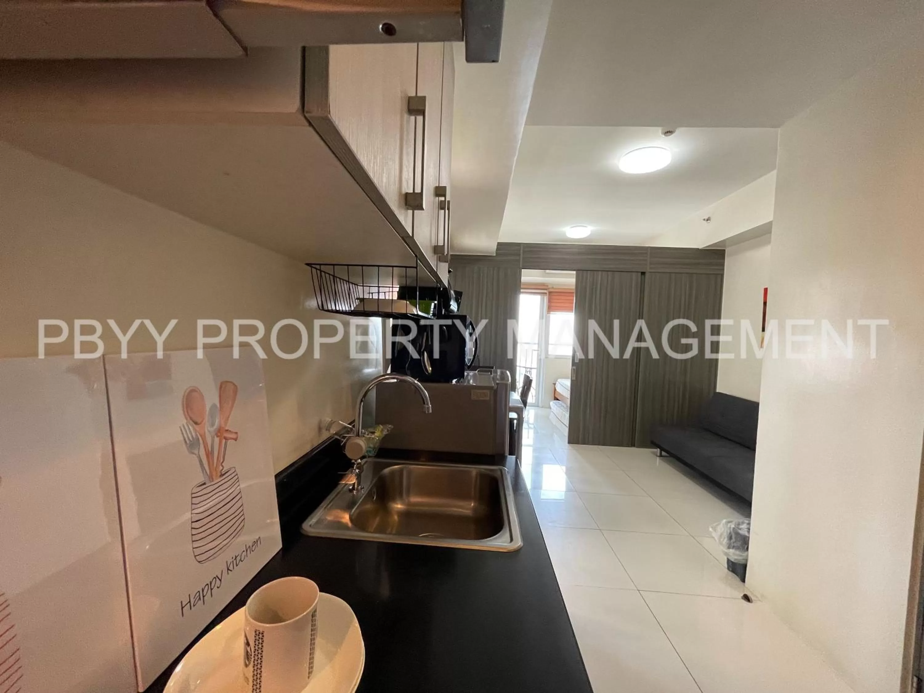 Kitchen or kitchenette in Green Residences Staycation by PBYY