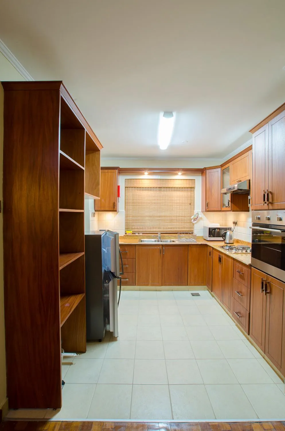 Kitchen or kitchenette in Waridi Paradise Hotel and Suites