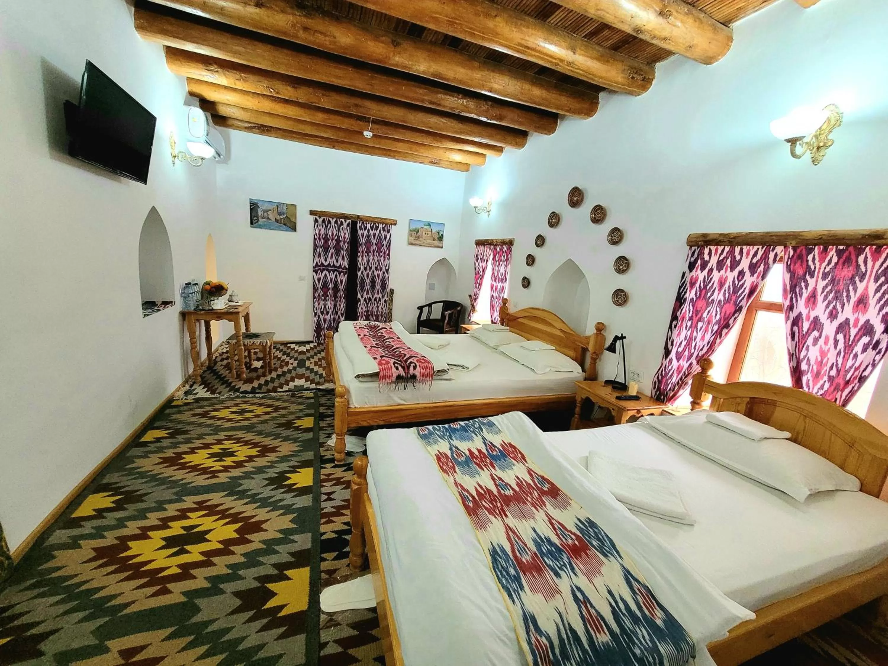Bed in madrasah Polvon-Qori boutique hotel