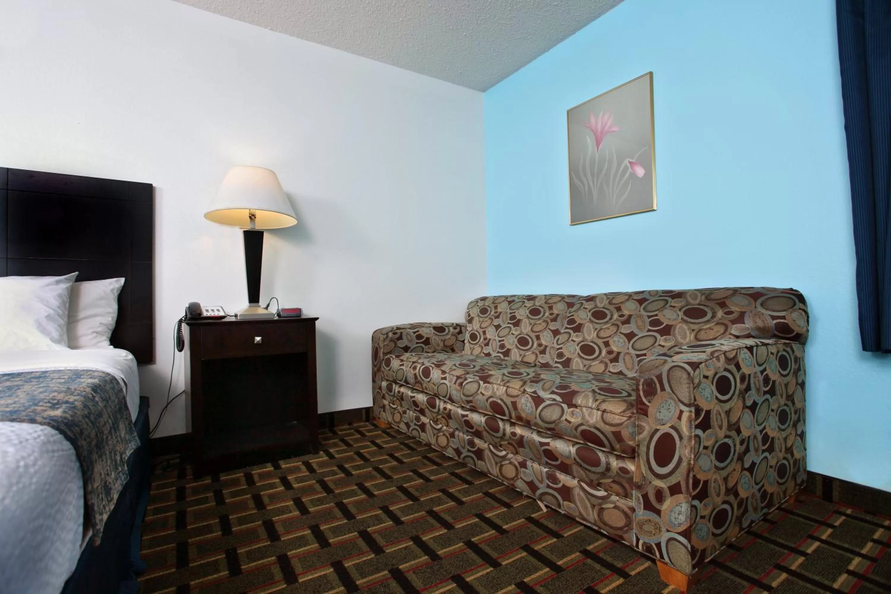 Bed in Coratel Inn & Suites by Jasper Newton