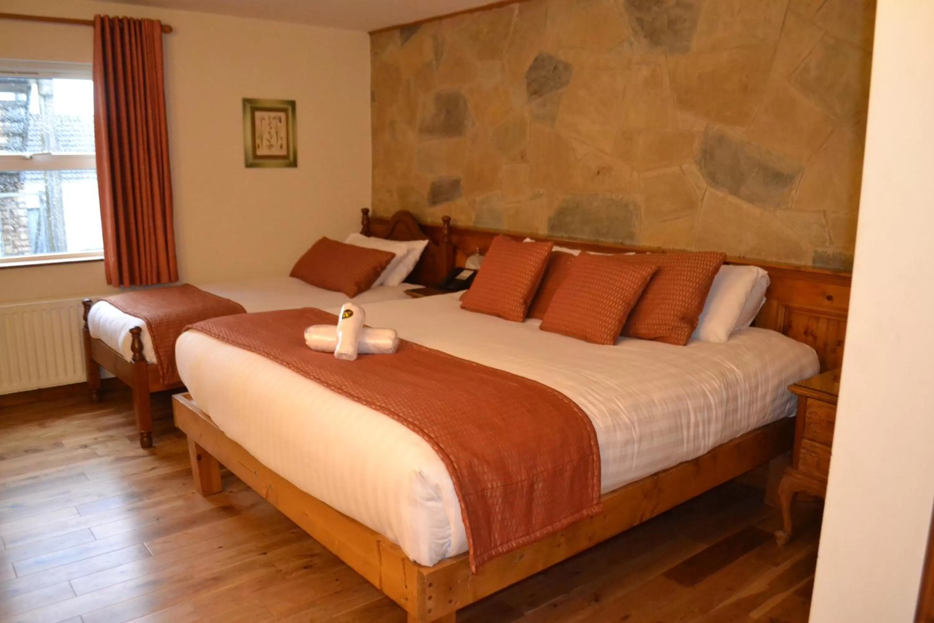 Bed in Walsh's Hotel and Apartments