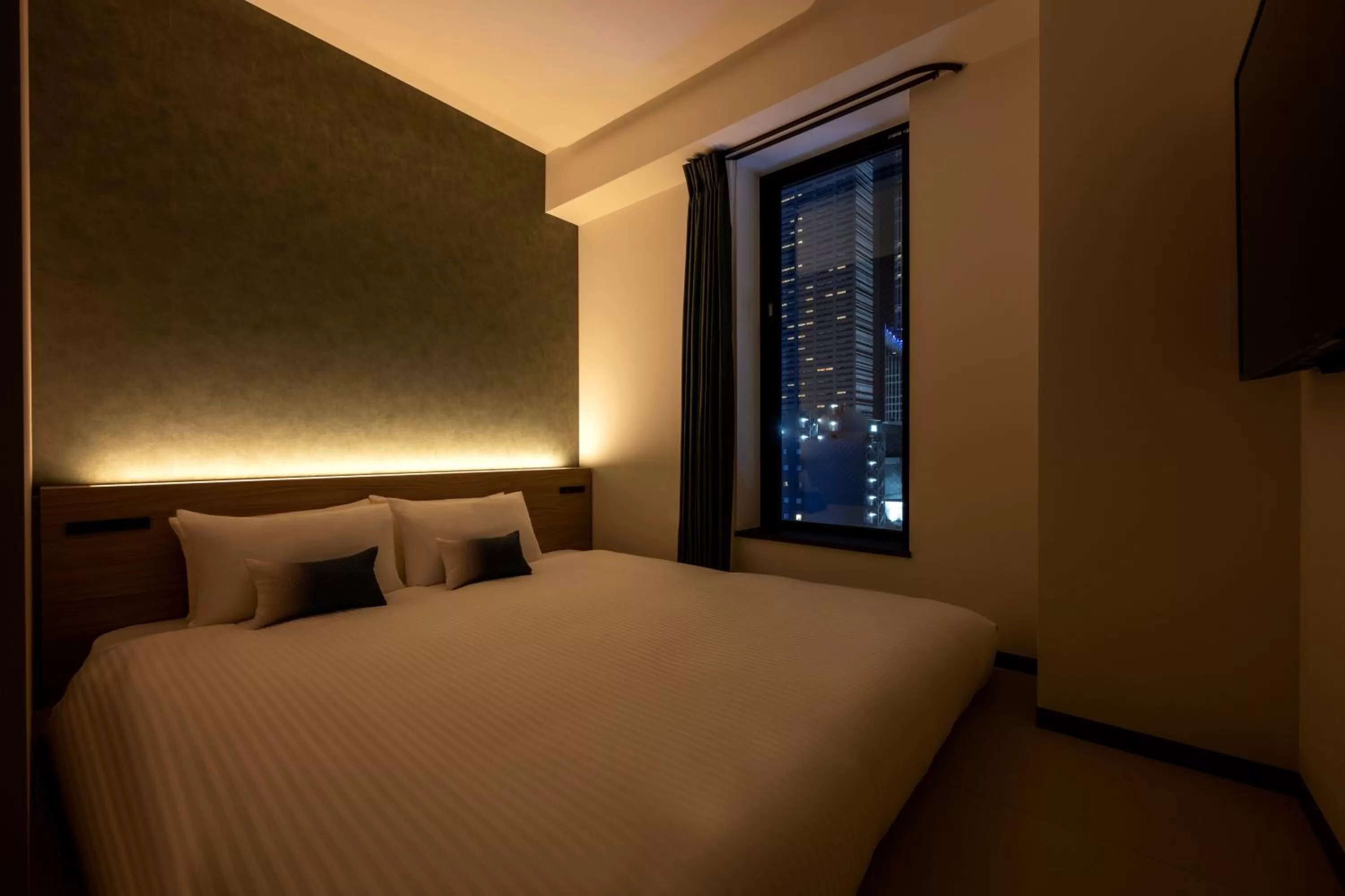 Photo of the whole room, Bed in HOTEL AMANEK Shinjuku Kabukicho