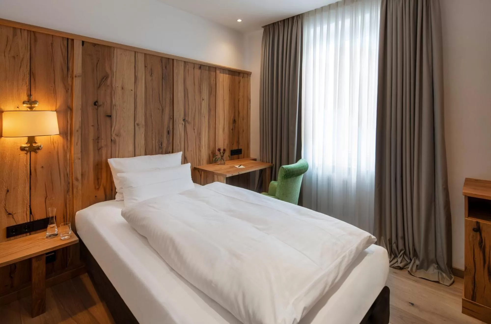 Bed in Eden Hotel Wolff