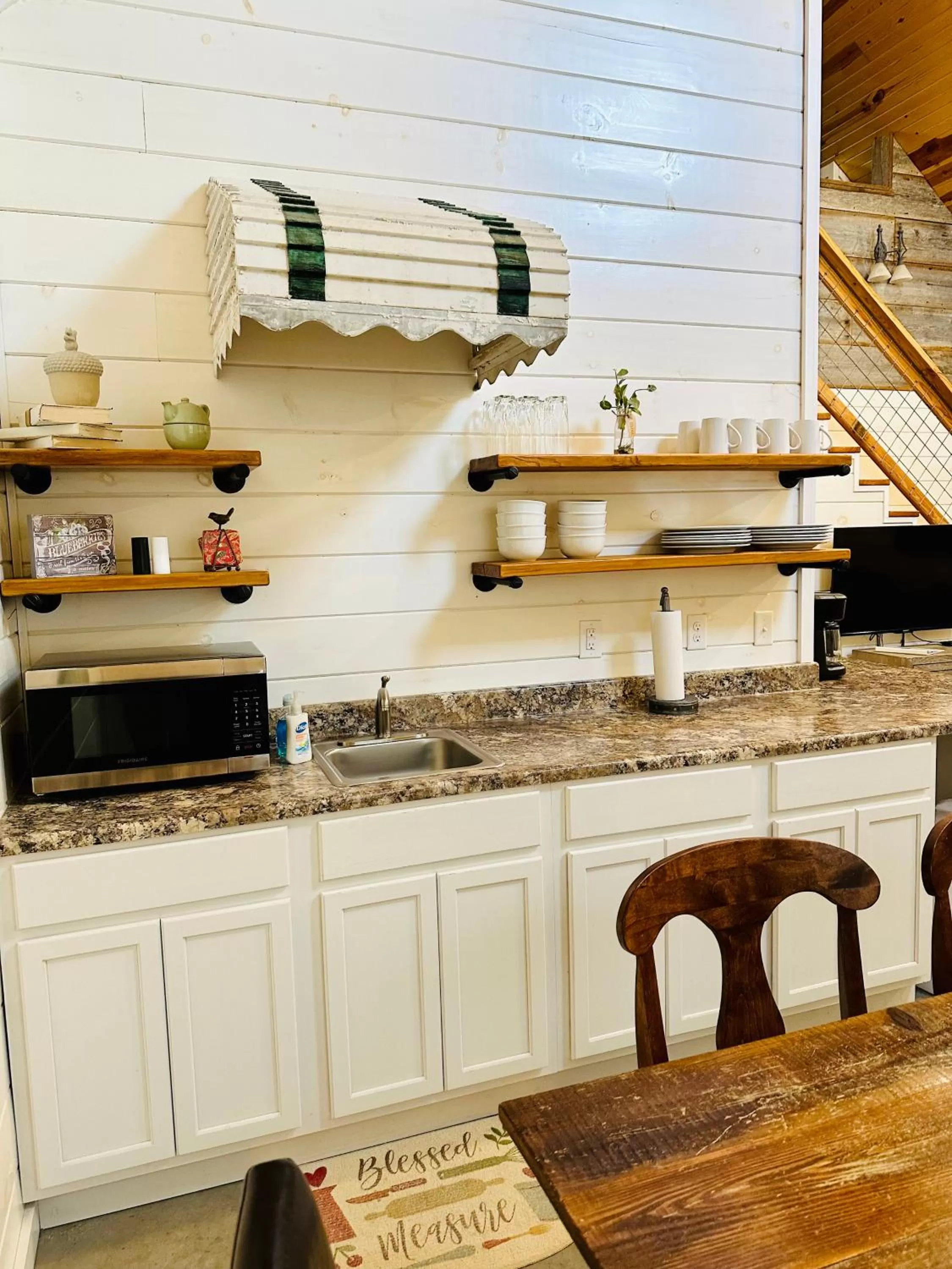 Kitchen or kitchenette in Knotty Squirrel Cabins