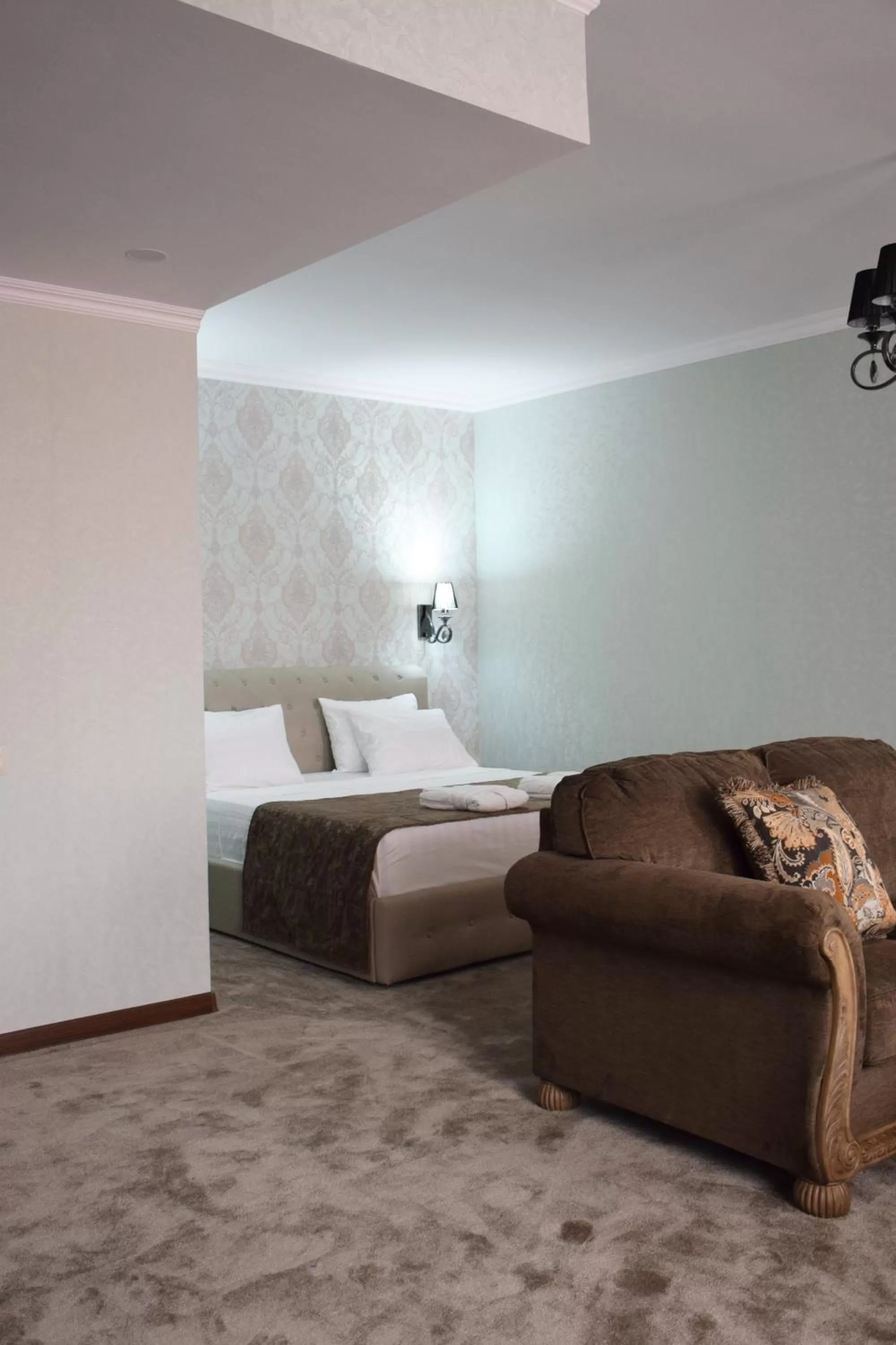 Bed in MirOtel Hotel