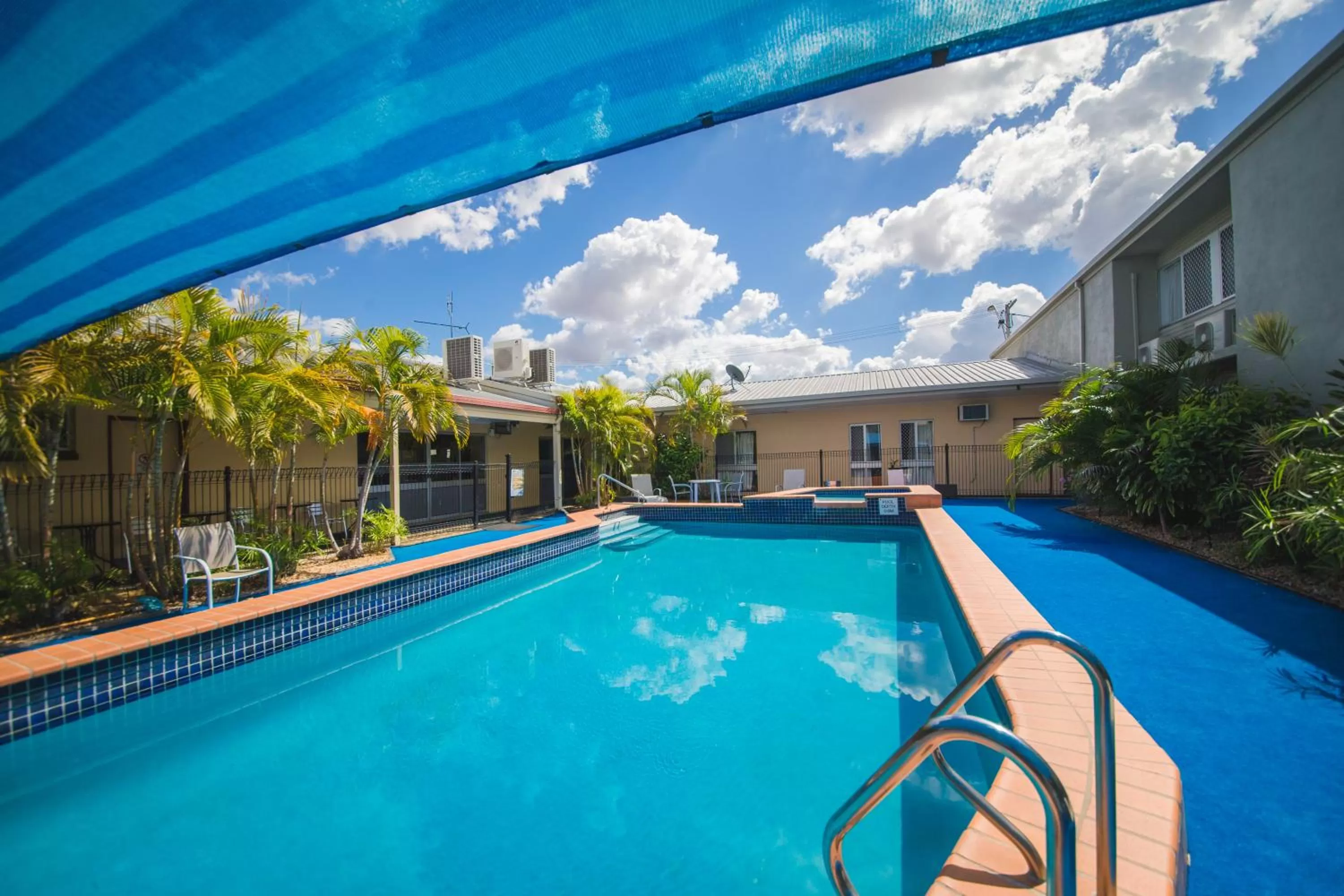 Swimming pool in Hampton Villa Motel